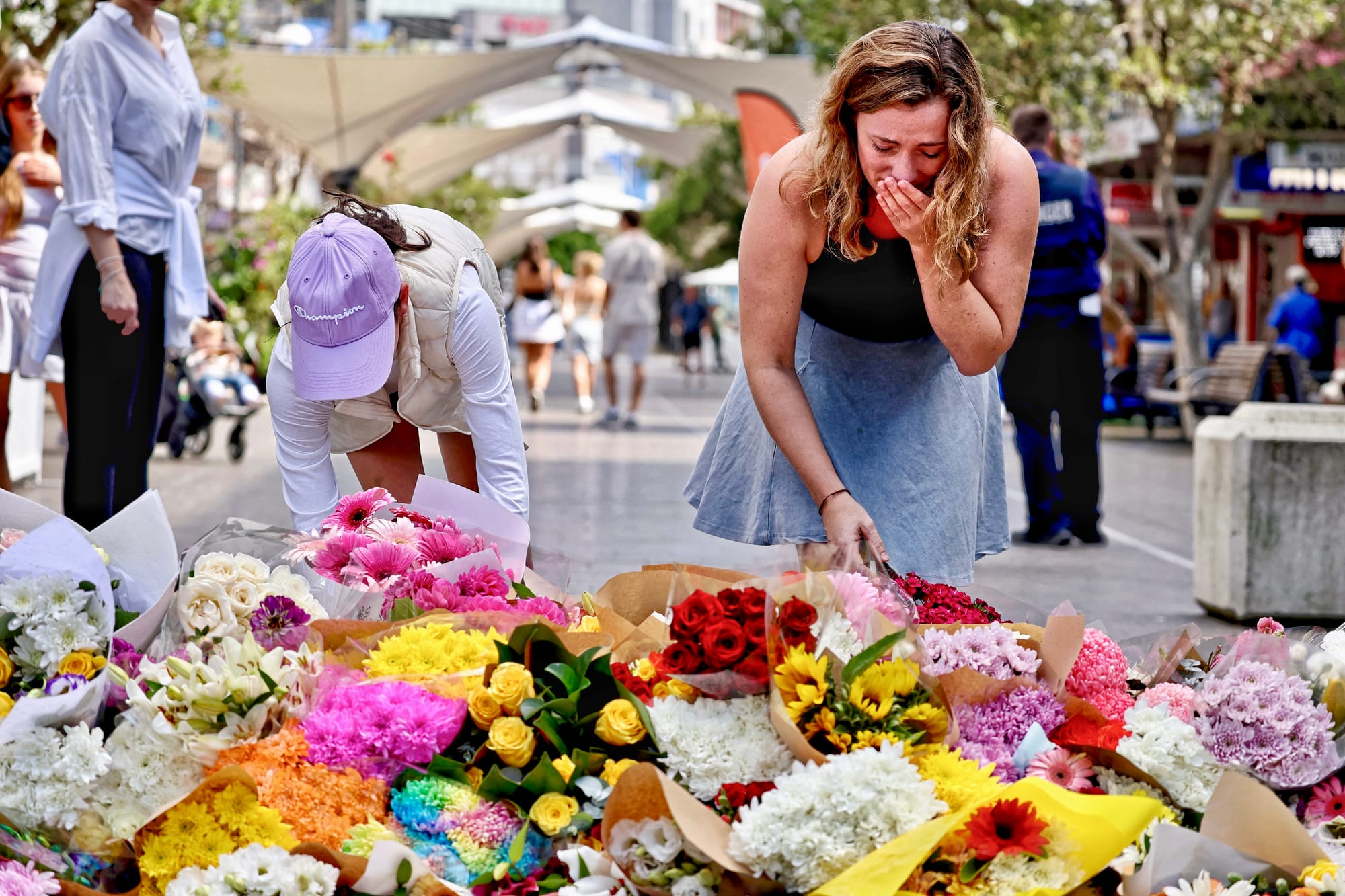 People mourn death of people in Sydney mall stabbing