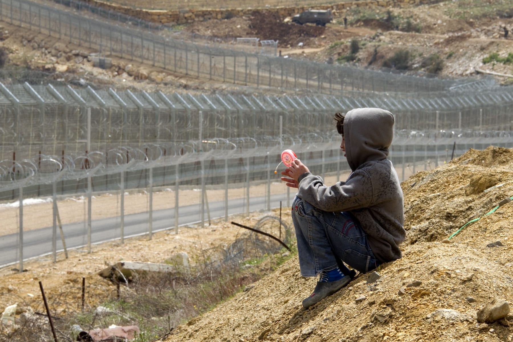 golan heights boy sitting israel hezbollah lebanon