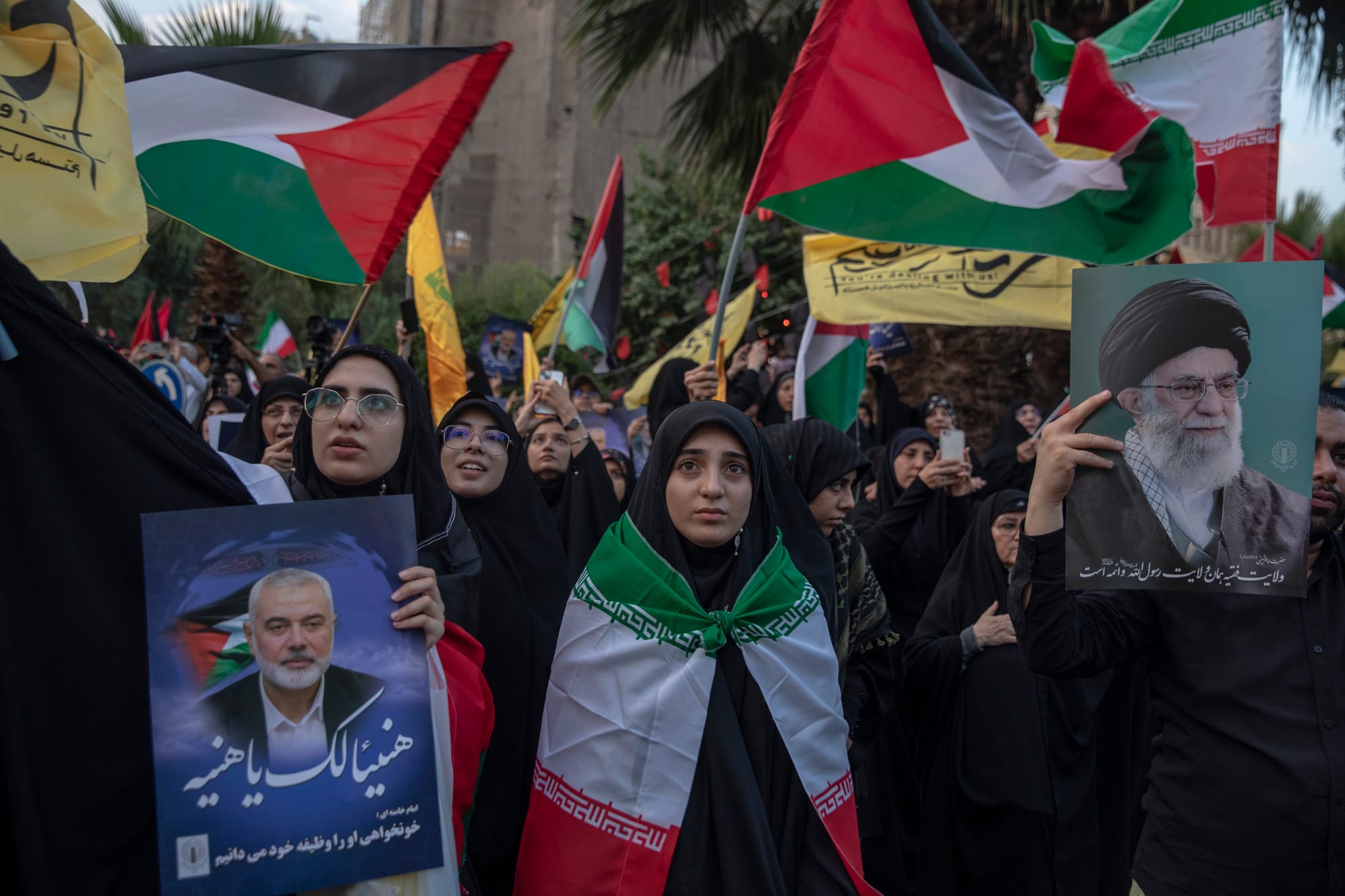 protesting Iranians protest against the killing of Ismail Haniyeh