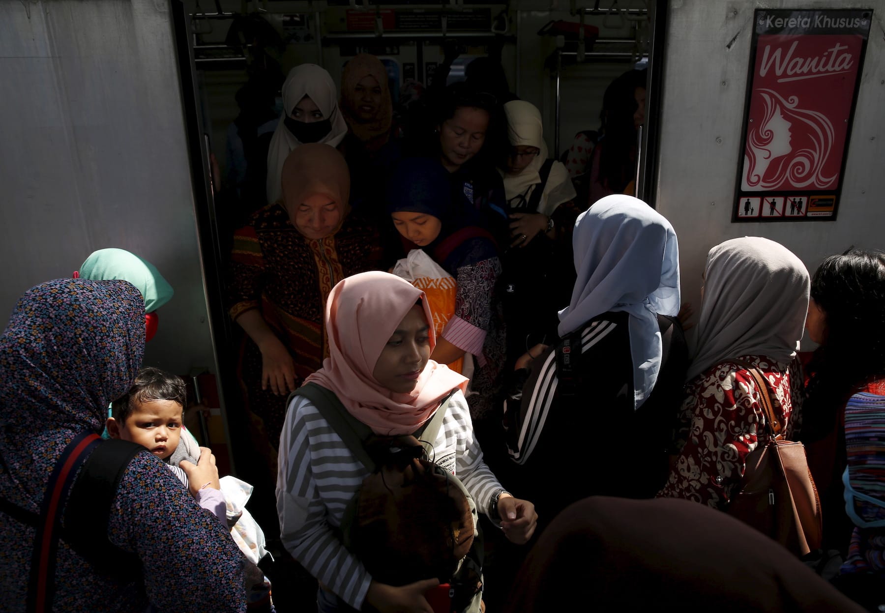 women traveling on train in indonesia