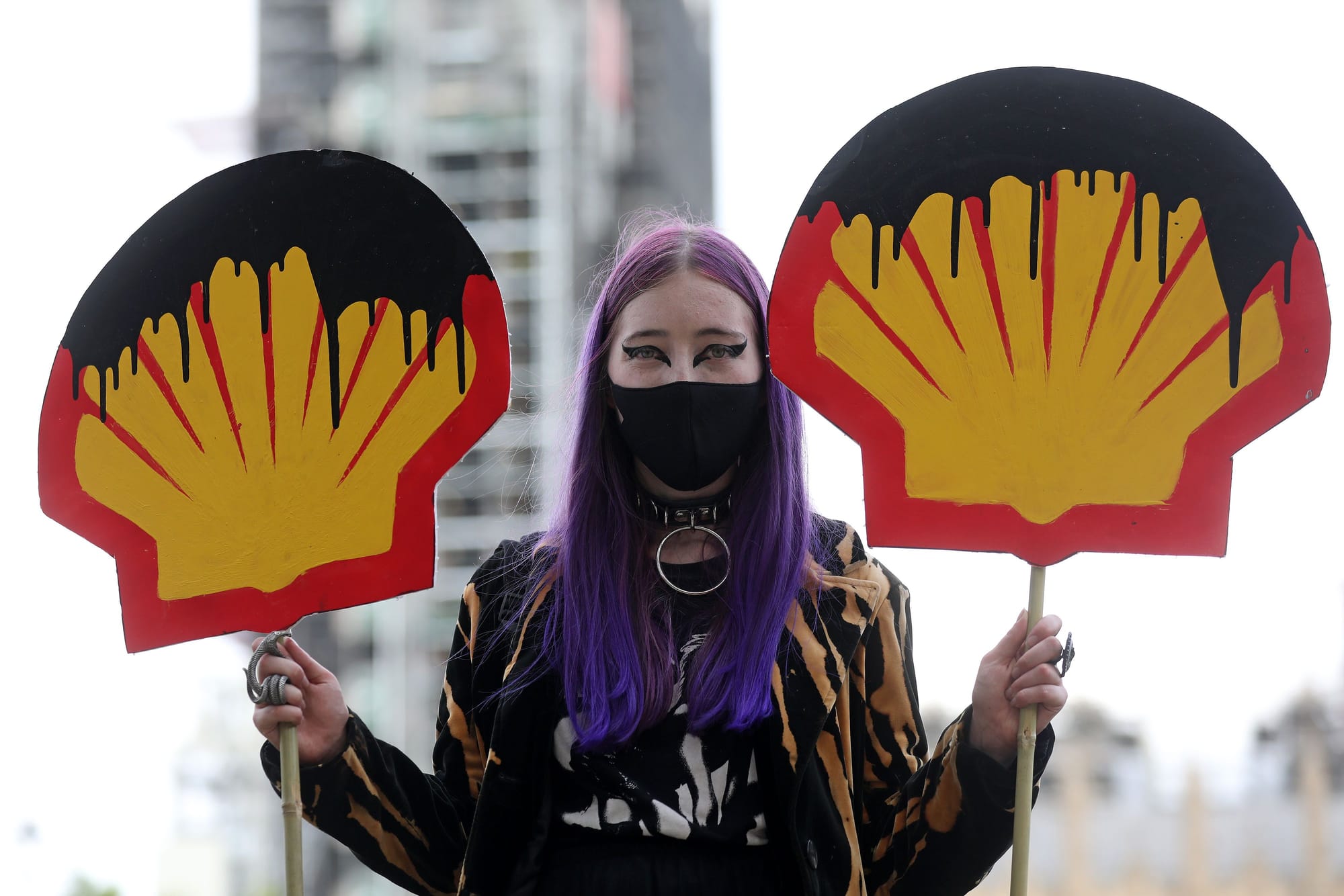 woman protest shell climate change