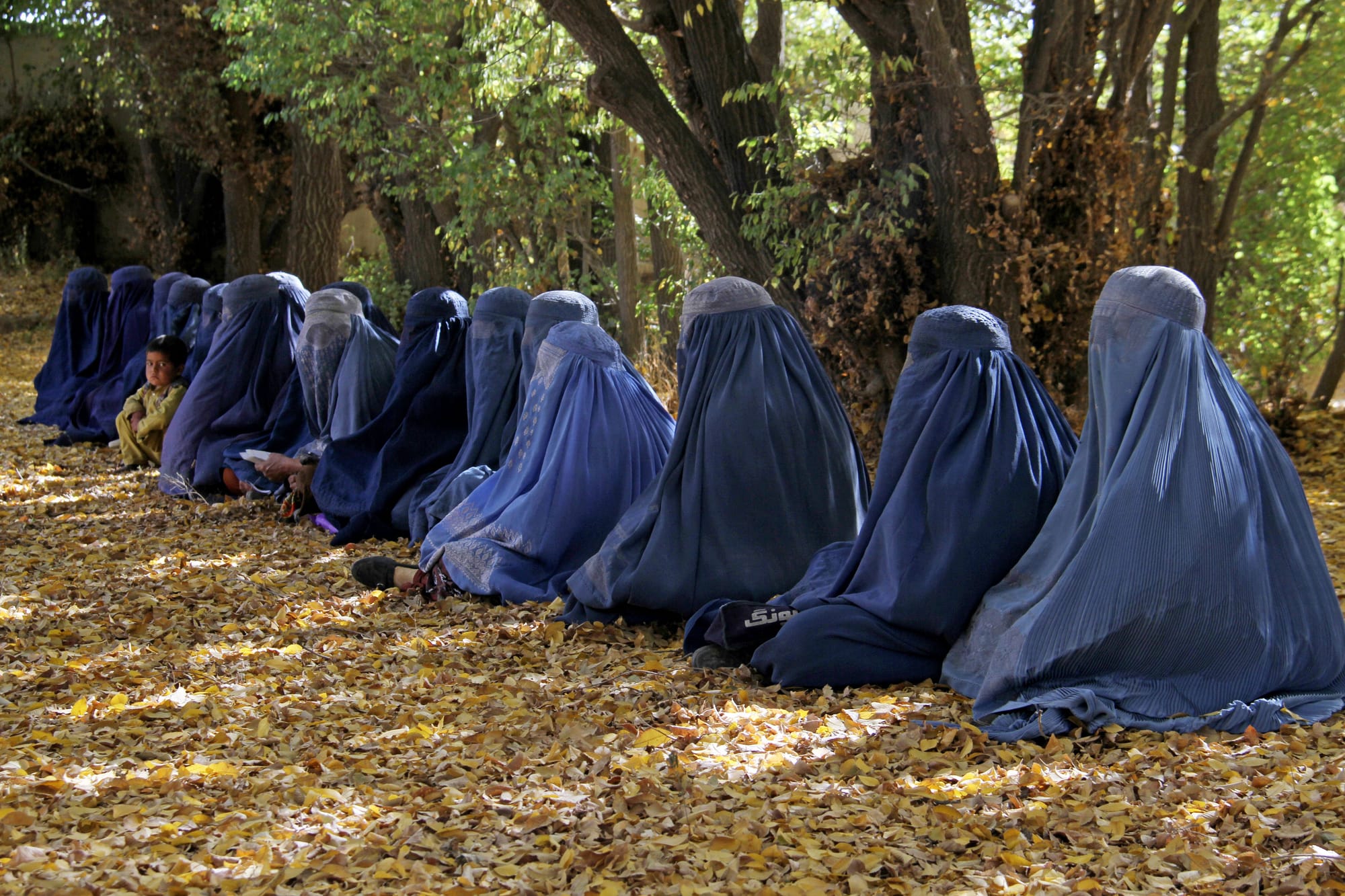 taliban ban women hearing each other afghanistan praying quran