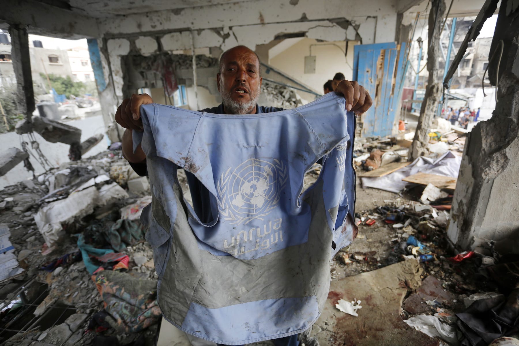 un worker in gaza unrwa destroyed