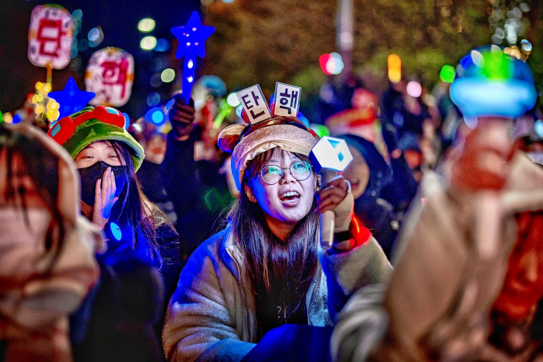 south korea woman protester exo light stick martial law