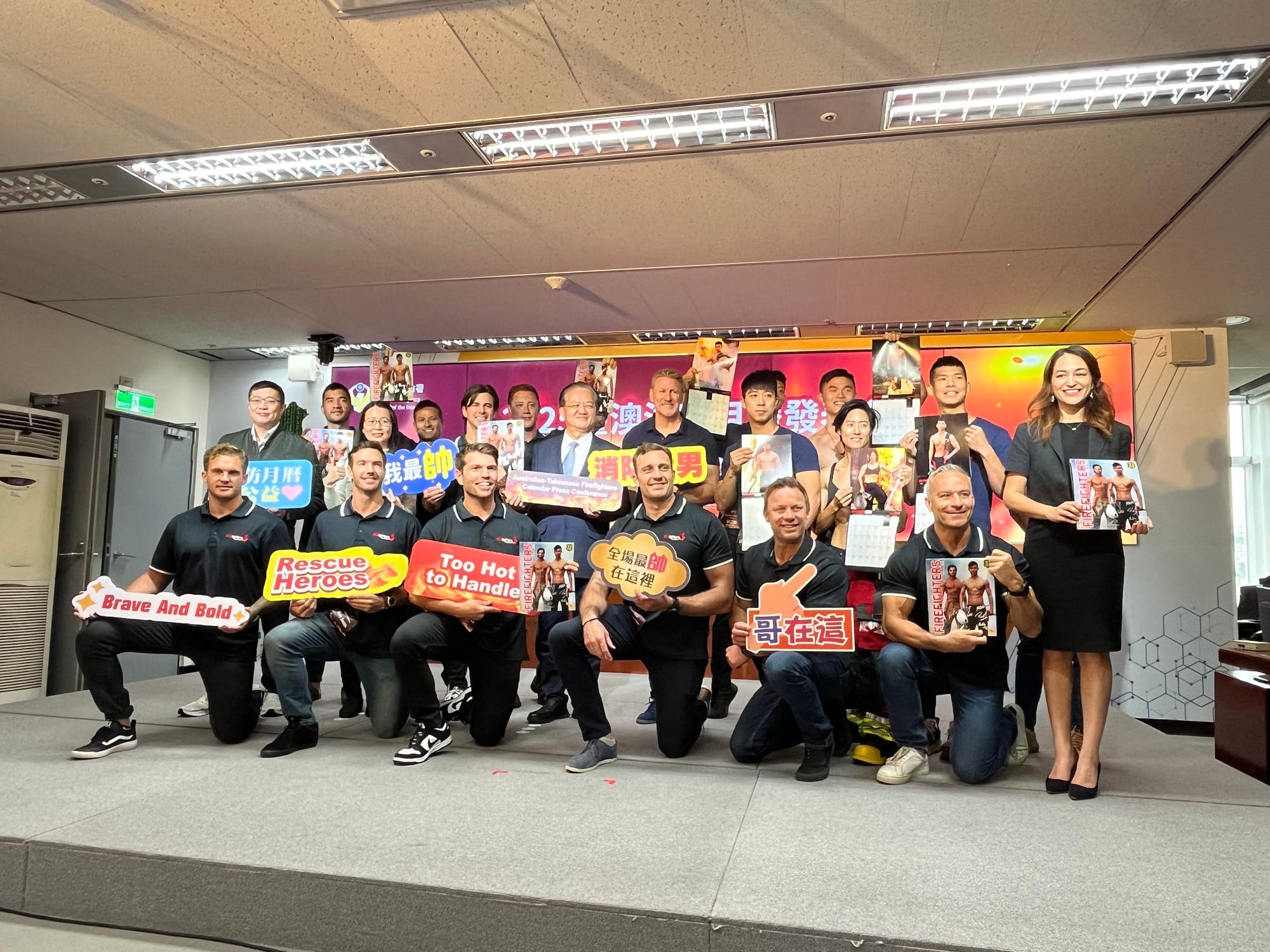 Taiwanese and Australian firefighters pose during the Taiwanes firefighters press conferece for the 32nd edition of the Australian firefighters calendar in Taipei Taiwan