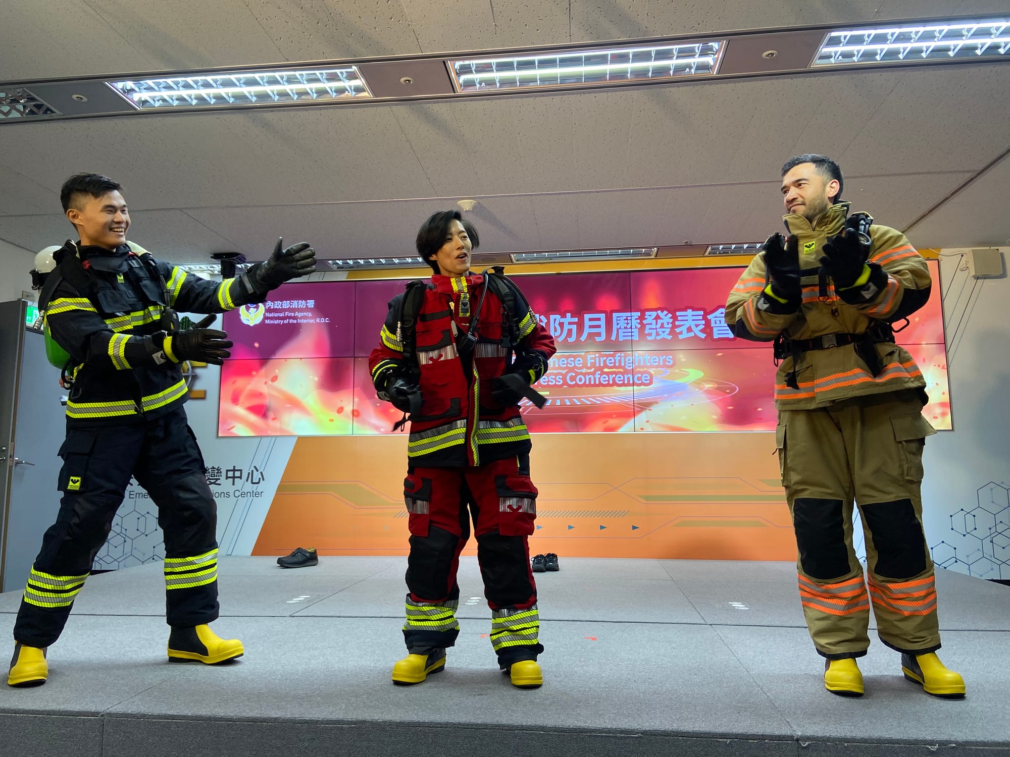 Taiwanese and Australian firefighters compete in challenges during the Taiwanes firefighters press conferece for the 32nd edition of the Australian firefighters calendar in Taipei Taiwan