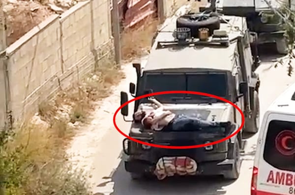 israel strap man military jeep human shield