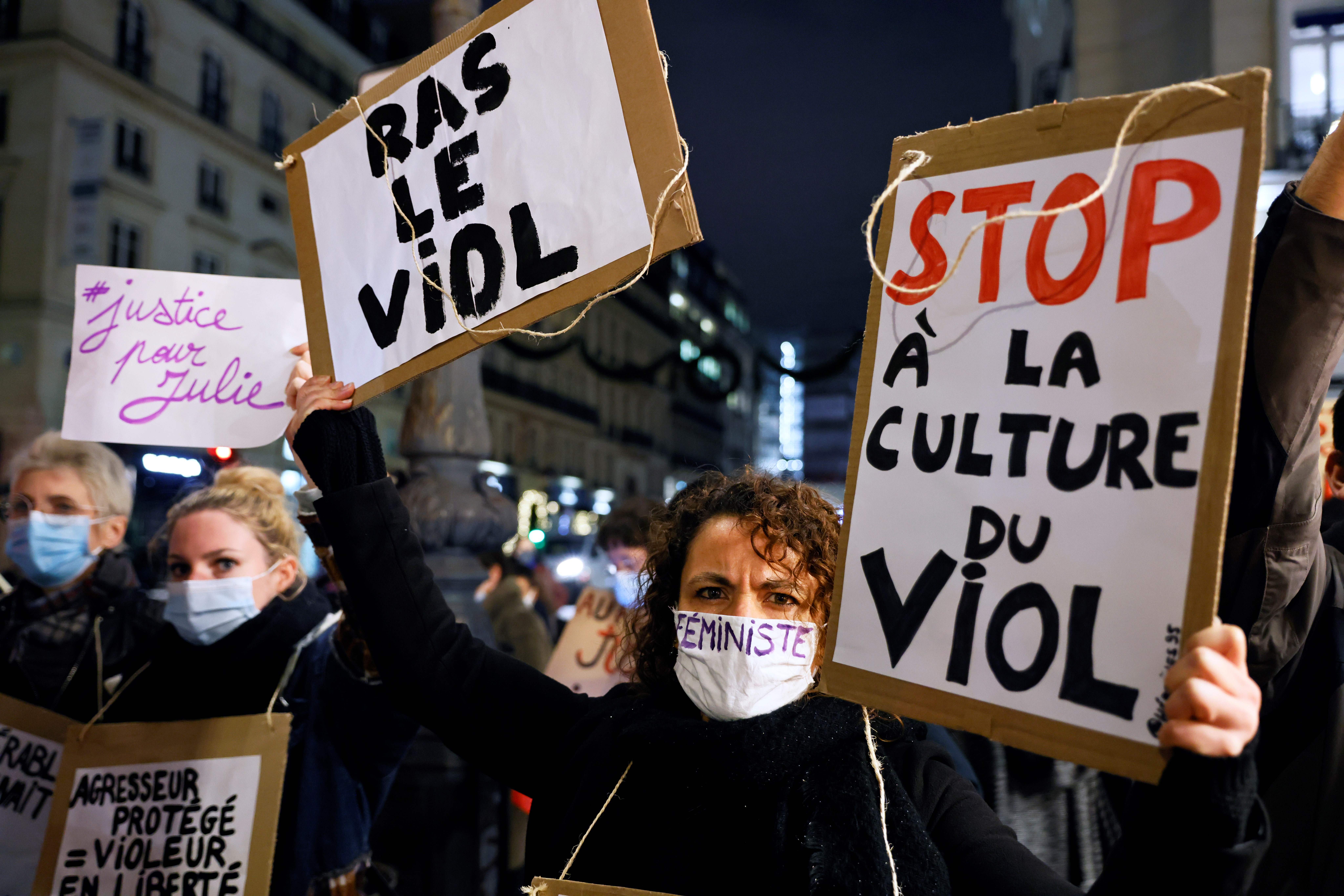Protesters hold placards including one readiing "Stop to the culture of rape" during a demonstration called by feminist groups after a French court retained the legal classification of "sexual infringement", in the accusation of three firefighters over relations with a 14-year-old minor, "Julie" photo.