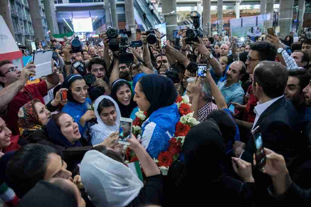 Kimia Alizadeh, 18, first Iranian woman to win an Olympic medal, is met by fans and the press after arriving at airport in Tehran, Iran.  