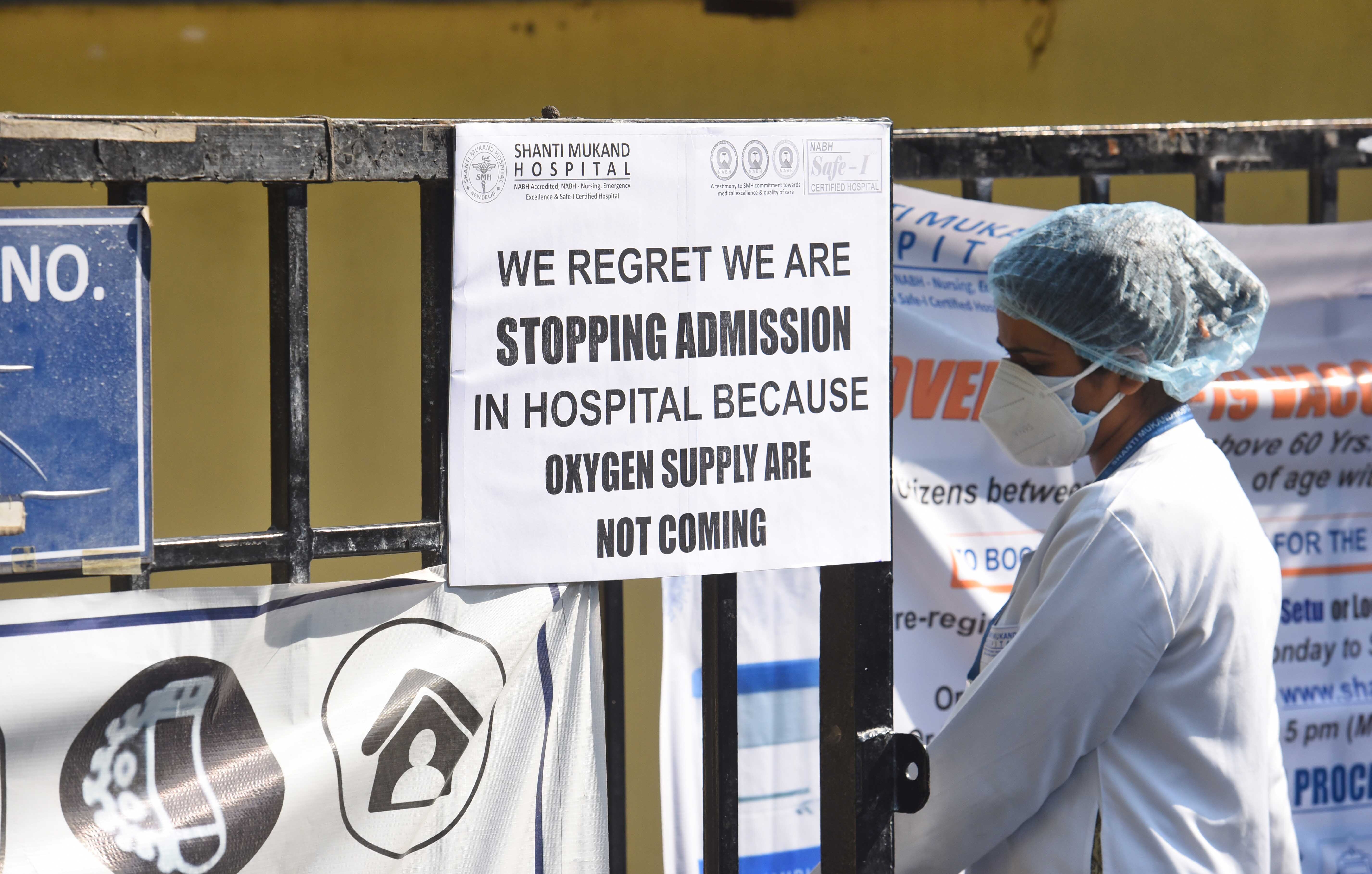 A public notice hangs outside Shanti Mukund Hospital notifying shortage of oxygen beds in New Delhi, India. Hospitals in several cities are facing an acute shortage of medical oxygen as Covid-19 cases rise rapidly.