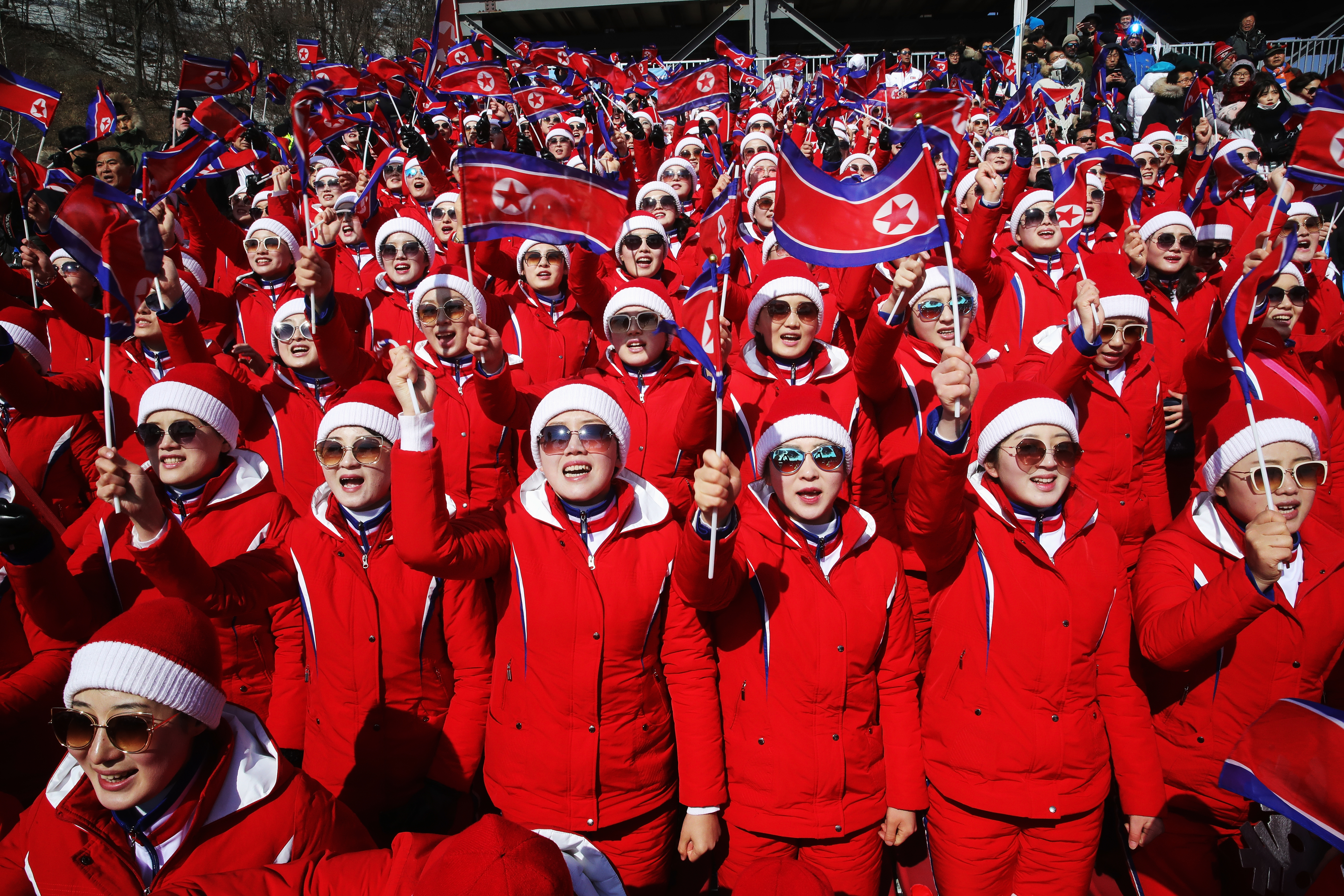 North Korea fans cheer at the finish during the Men's Slalom on day 13 of the PyeongChang 2018 Winter Olympic Games at Yongpyong Alpine Centre in South Korea photo.