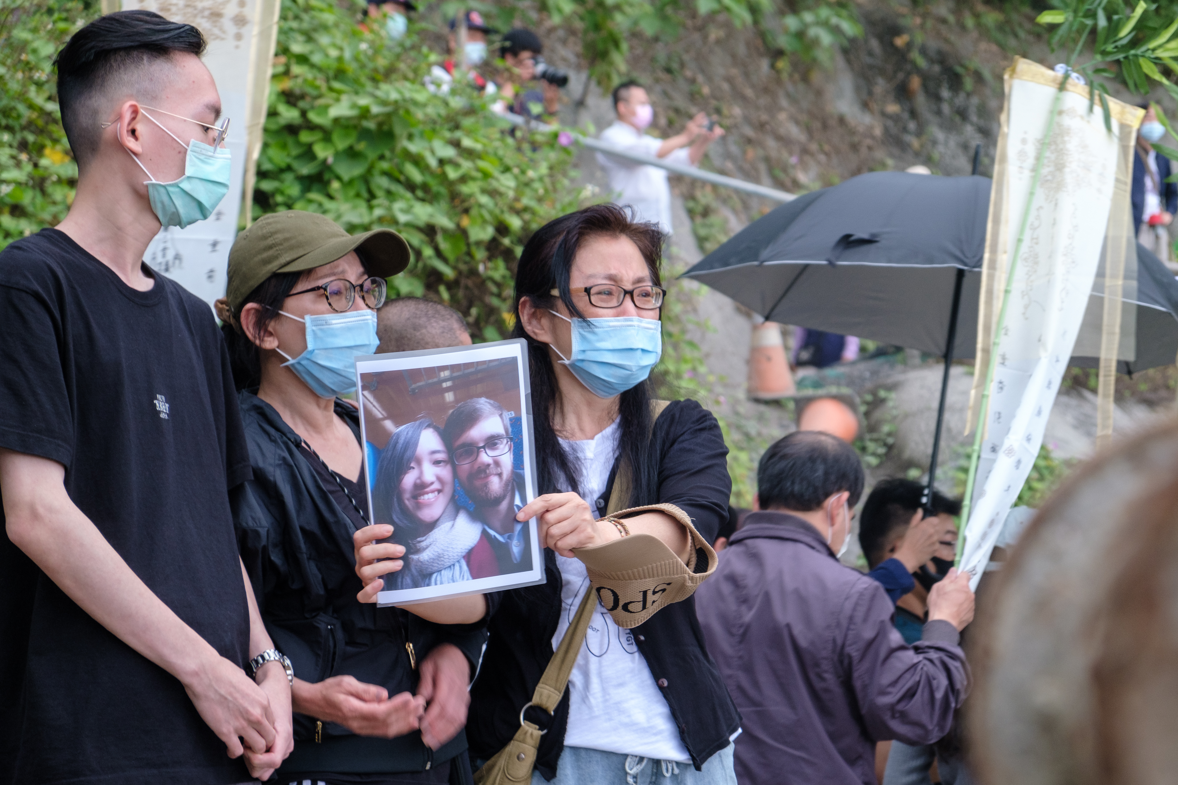 Families of the train crash victims and monks mourn for deceased relatives in front of the accident spot the day after the train derailed with at least 51 dead and dozens injured in Hualien, Taiwan photo.