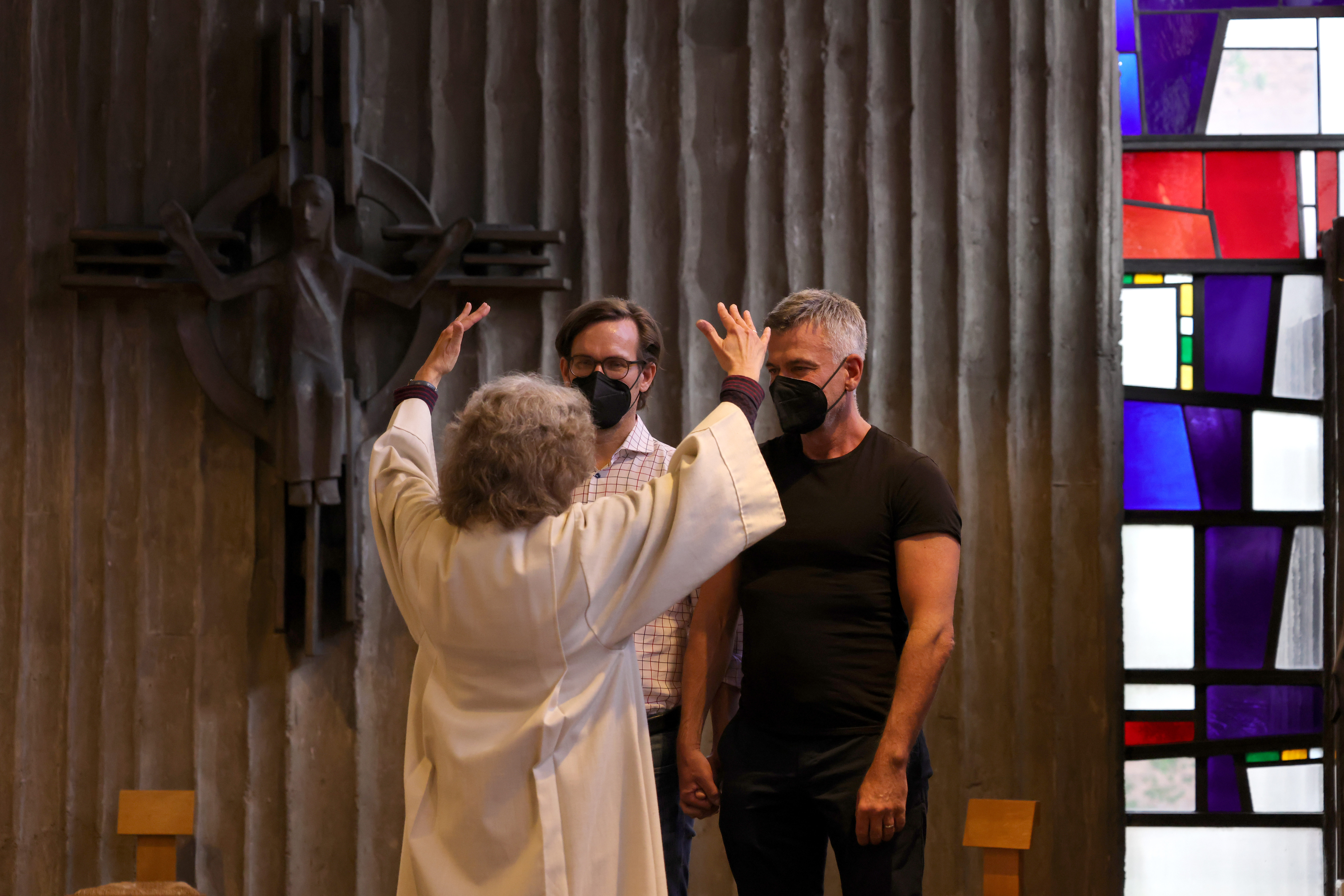 Brigitte Schmidt, a pastoral worker blesses a same-sex couple, Ralf Michael Berger and Andreas Helfrich, at the Catholic St. Johannes XXIII church in Cologne, Germany.