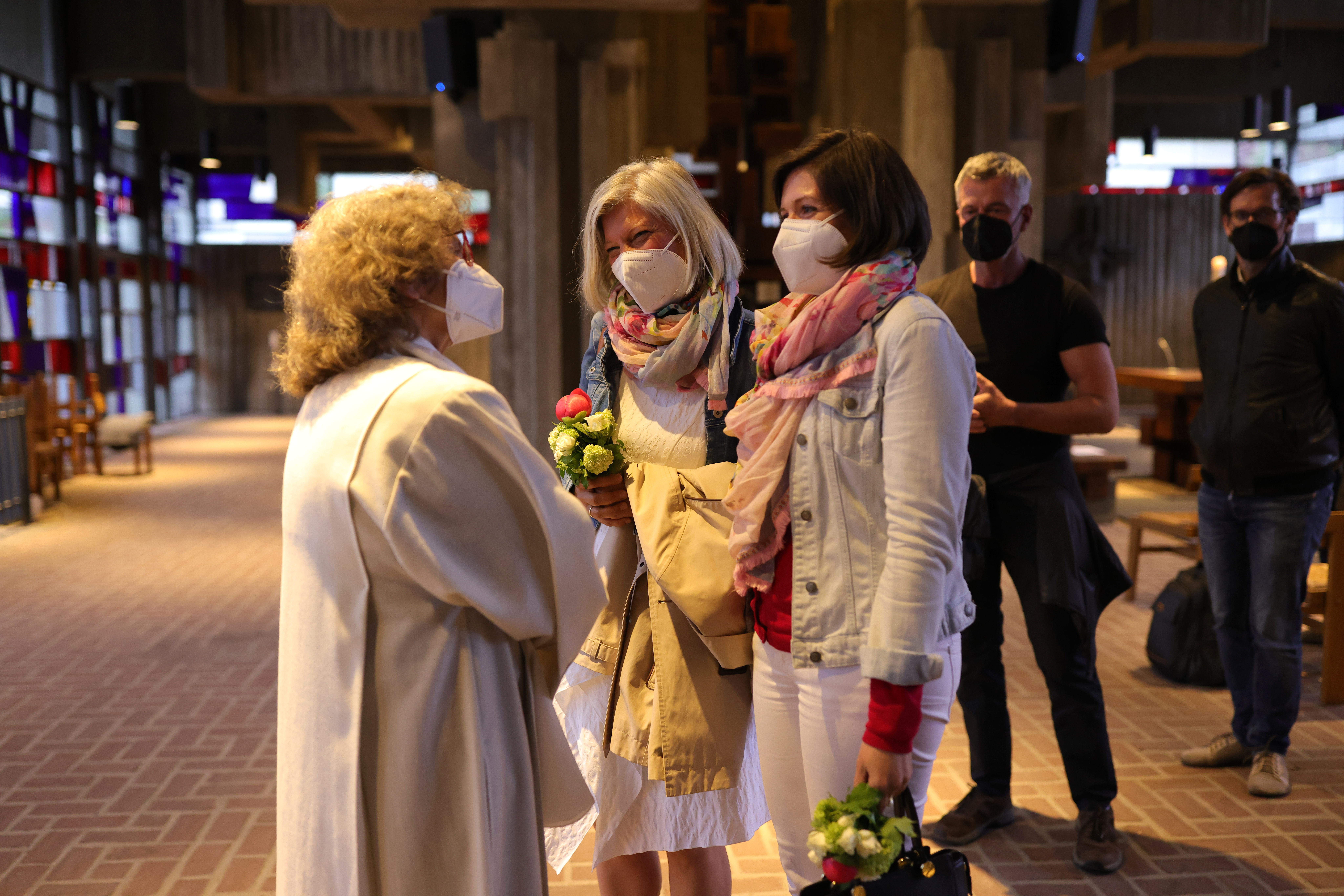 Brigitte Schmidt (L), a pastoral worker chats with Nini and Juliana Weinmeister-Bisping after she blesses the same-sex couple at the Catholic St. Johannes XXIII church in Cologne, Germany. The Catholic Church in Germany is currently going through a tumultuous phase that includes a high number of followers leaving the Church due to what many say are insufficient consequences from wide-scale sexual abuse by priests as well as far-reaching calls for reform for greater inclusion of women and recognition of gay marriage.