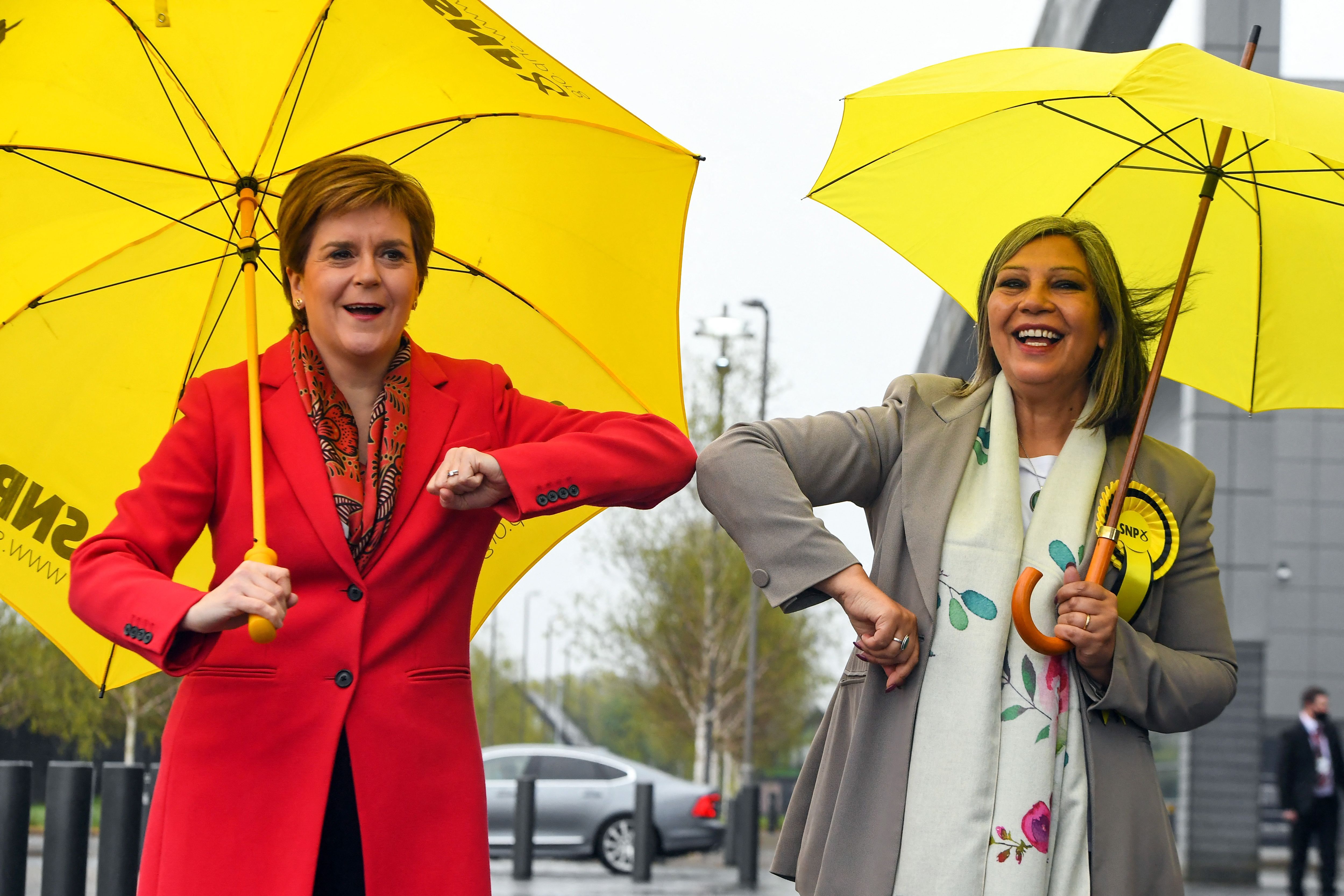 Scotland's First Minister and leader of the Scottish National Party (SNP), Nicola Sturgeon (L) congratulates SNP candidate Kaukab Stewart after she was elected MSP for Glasgow Kelvin in the Scottish Parliamentary Election, in Glasgow.