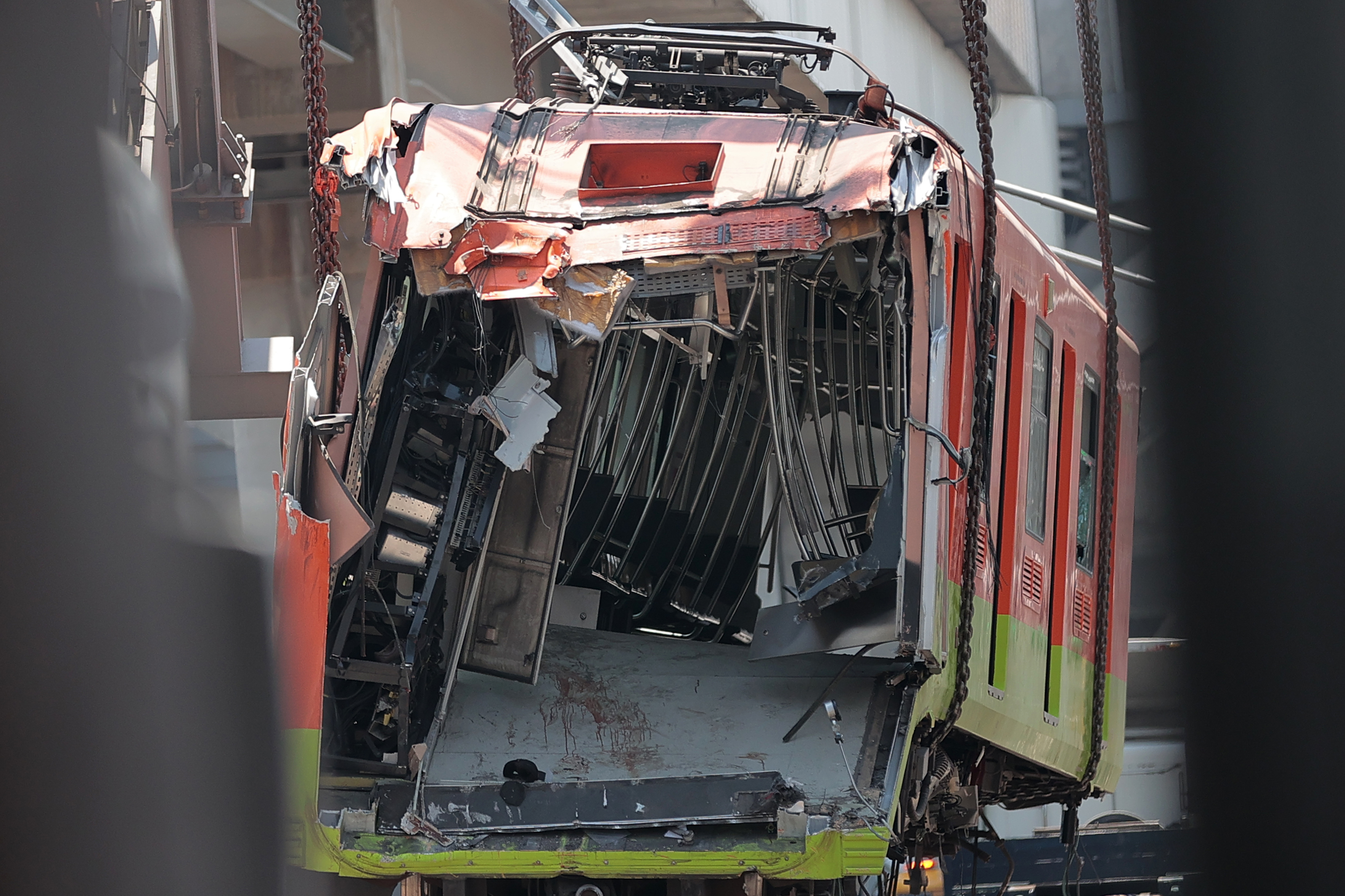 View of a crashed train carriage after a train overpass collapsed last night killing 23 people in Mexico City, Mexico.