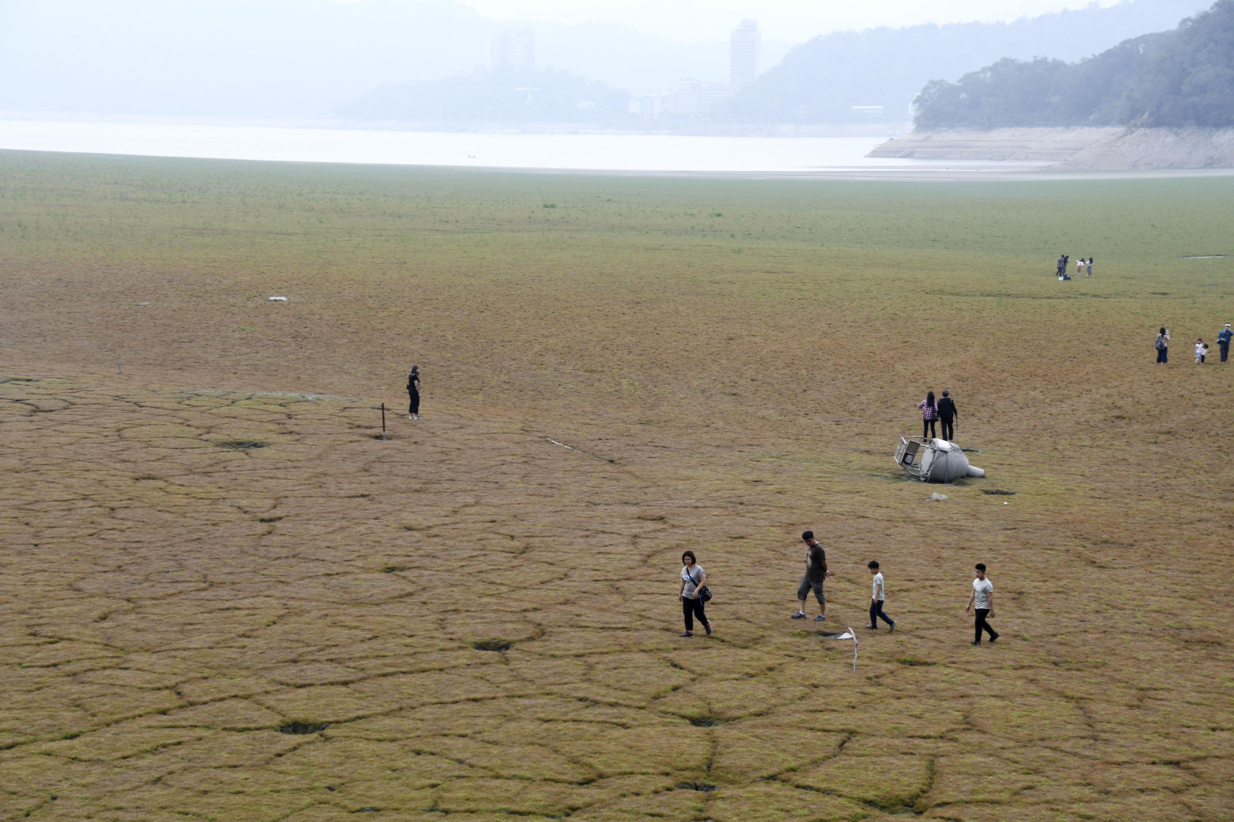 People visit dried up Sun Moon Lake in Taiwan's Nantou County, as Taiwan has experienced its worst drought in half a century.