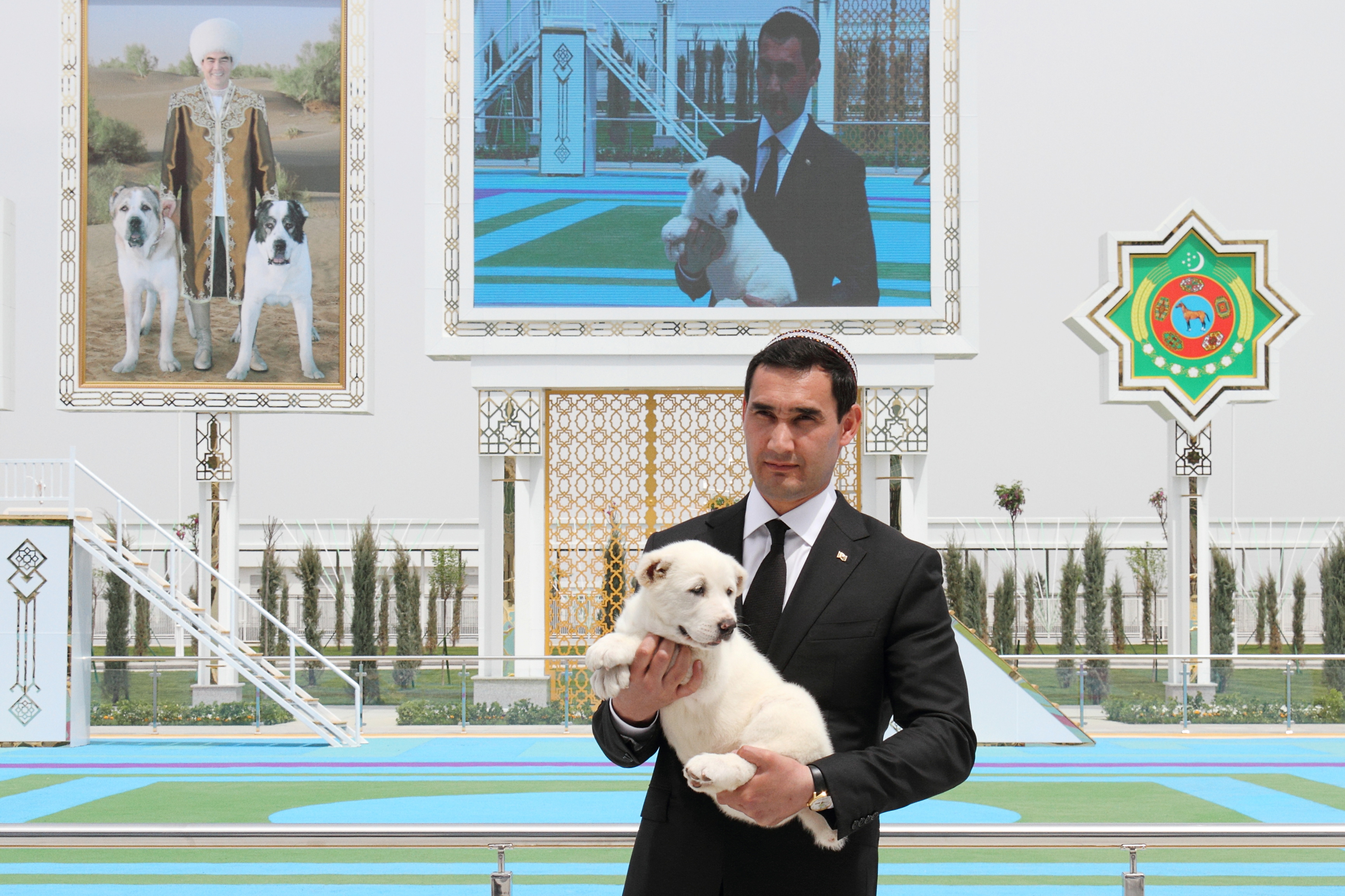 Turkmenistan's Deputy Prime Minister Serdar Berdymukhamedov, son of President Kurbanguly Berdymukhamedov, holds a puppy of a Turkmen shepherd dog, locally known as Alabai, during celebrations for the national Turkmen Horse Day and the Turkmen Shepherd Dog Day, near Ashgabat, Turkmenistan.