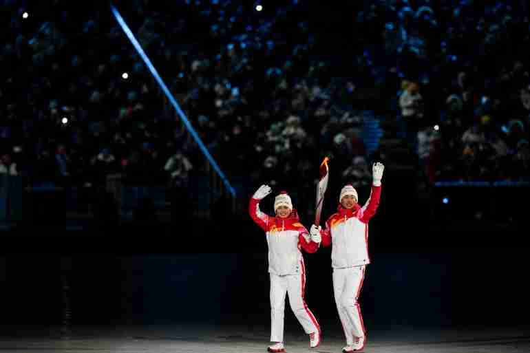 china uyghur torch bearer olympics dinigeer yilamujiang