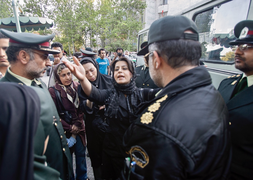 women protest military policemen