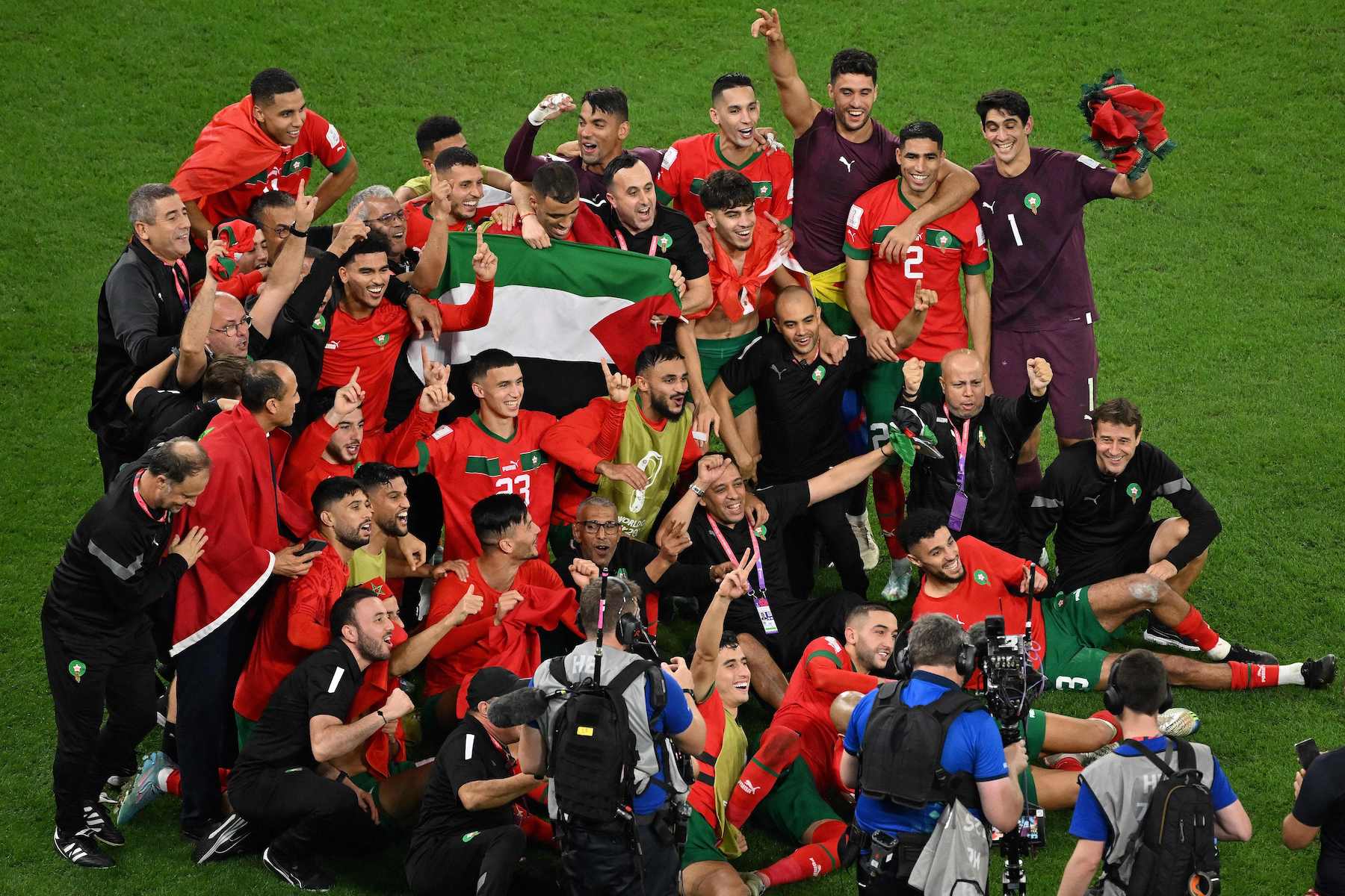 Morocco’s Soccer Team And Fans Celebrate Their Historic Win Against Spain By Waving Palestine’s Flag