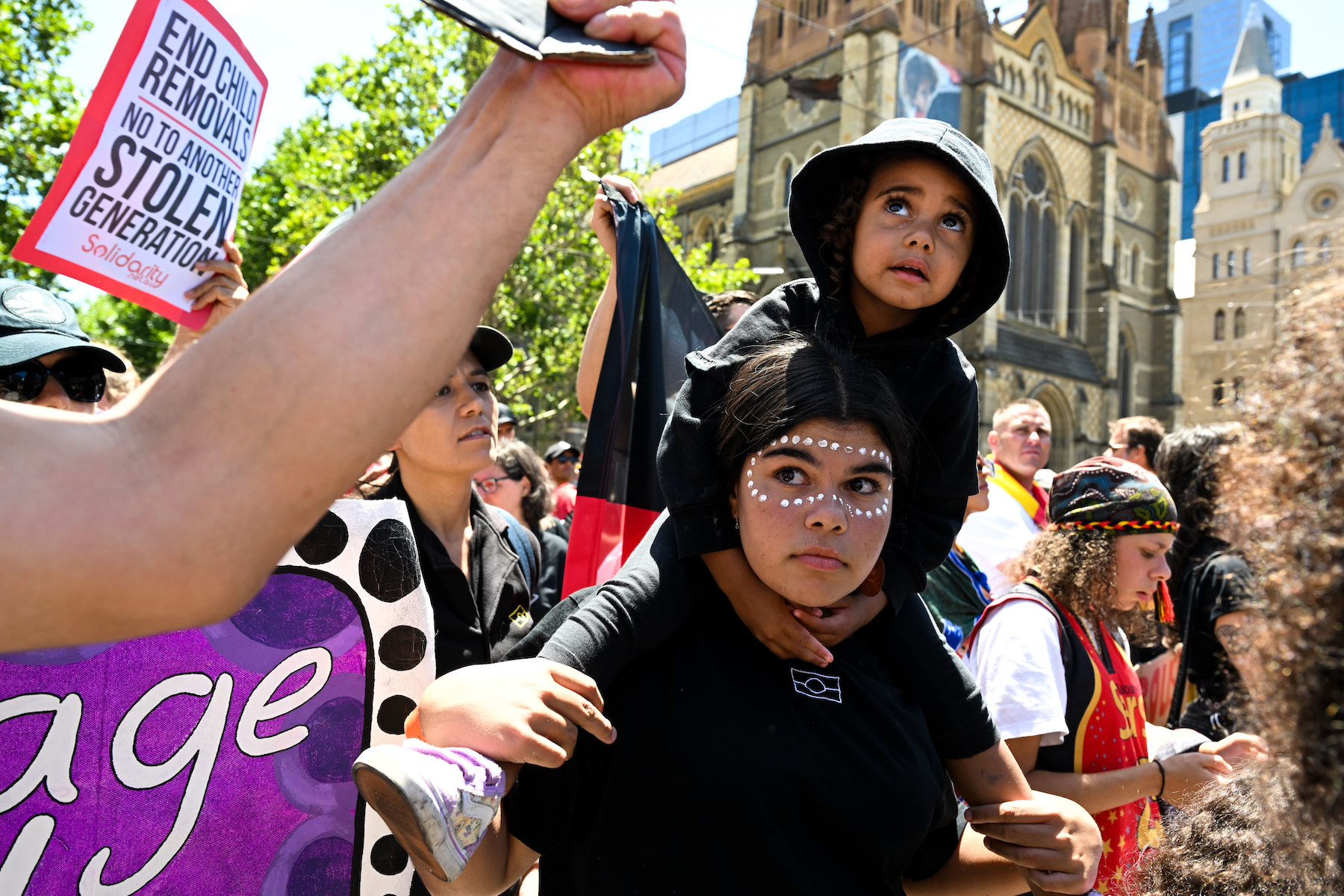 woman protester with kid australia invasion day protest 2023