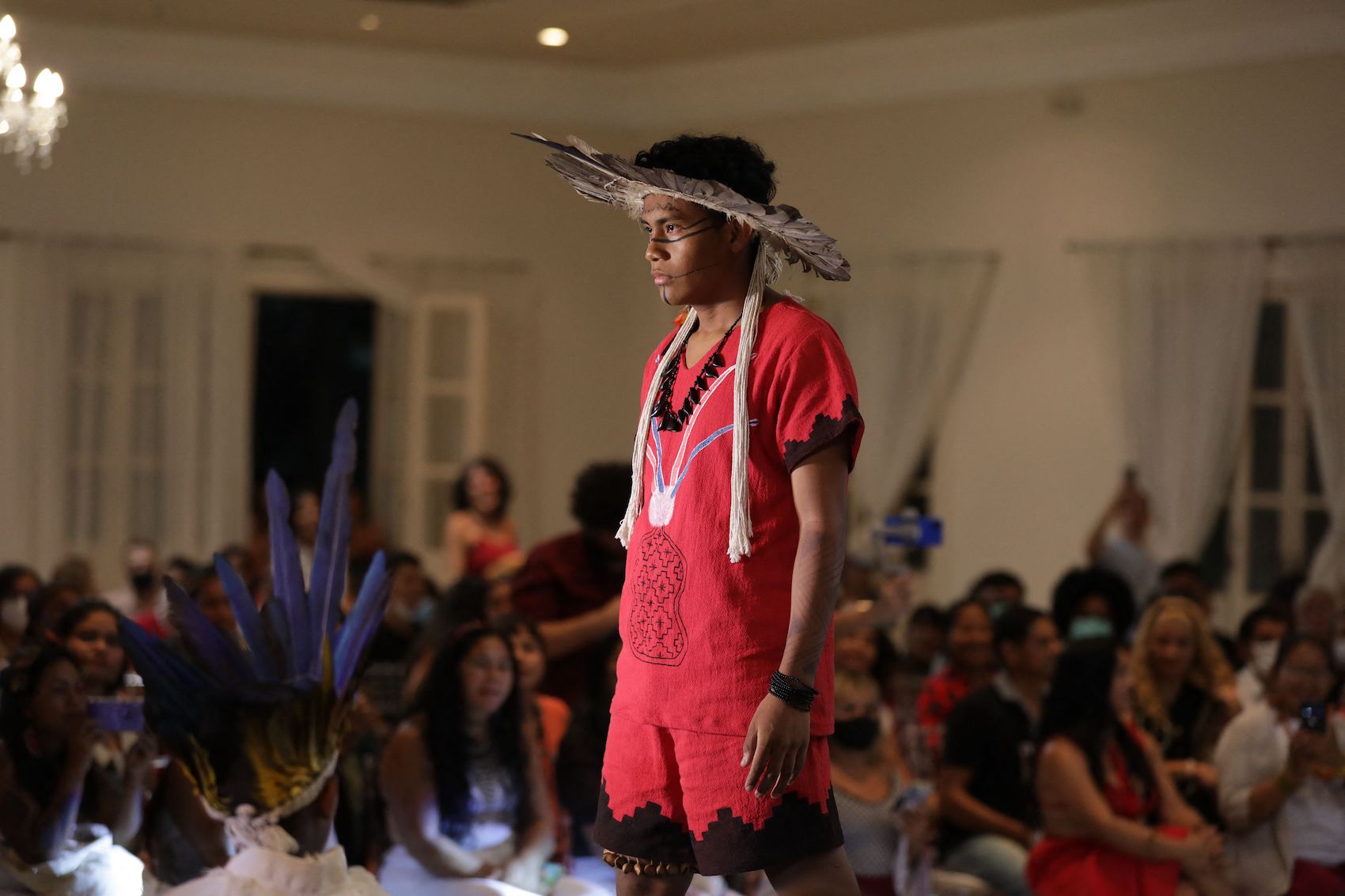 An indigenous model presents a creation during a fashion event in Manaus, Amazonas state, Brazil