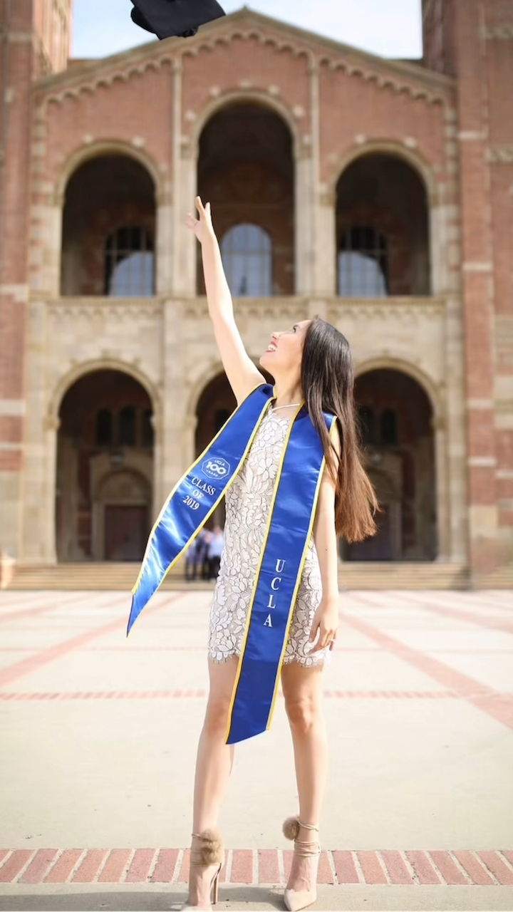 Katya Echazarreta first mexican woman into space graduating from UCLA standing and pointing at the sky