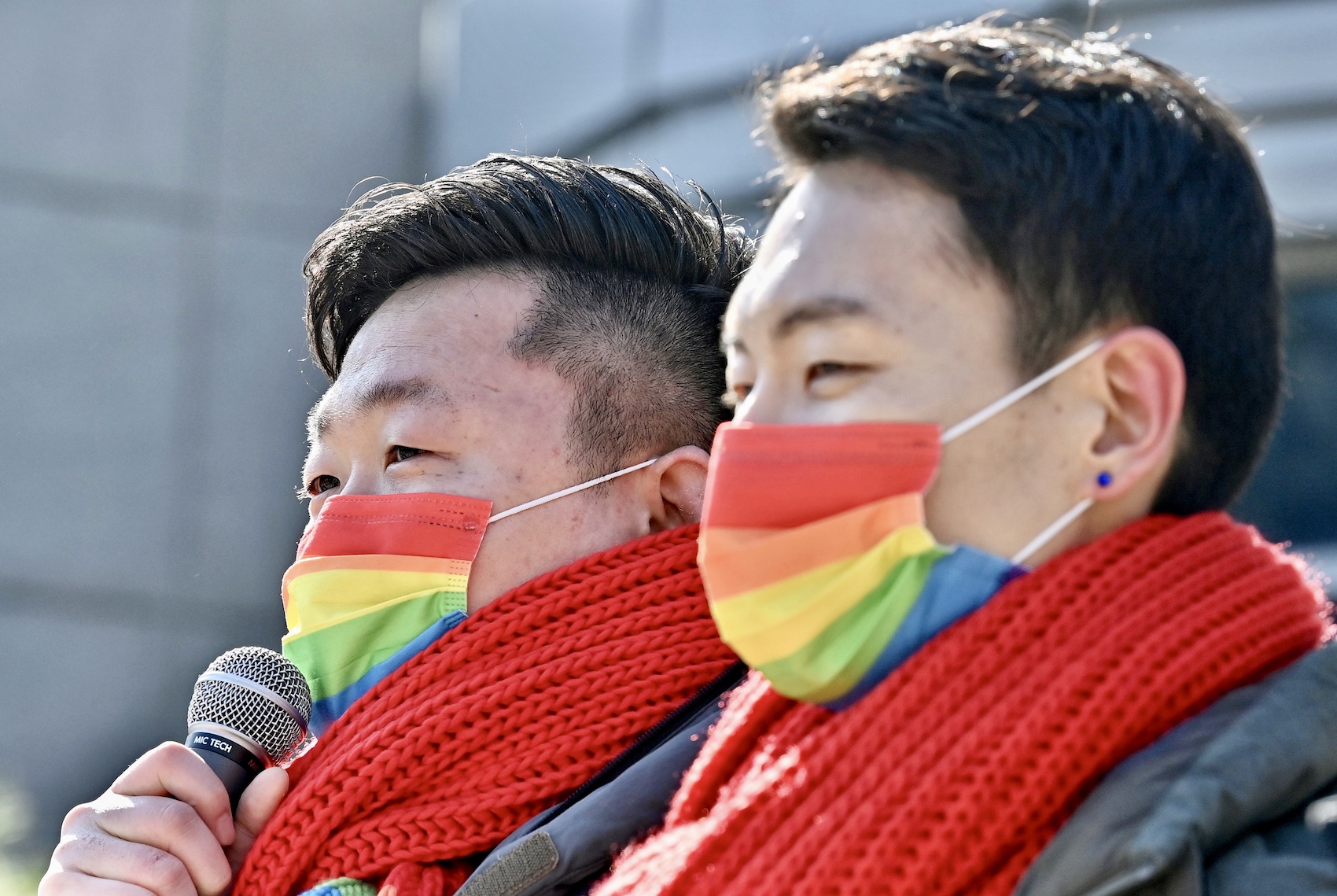South Korean same-sex couple So Seong-wook (L) and Kim Yong-min (R) attend a press conference