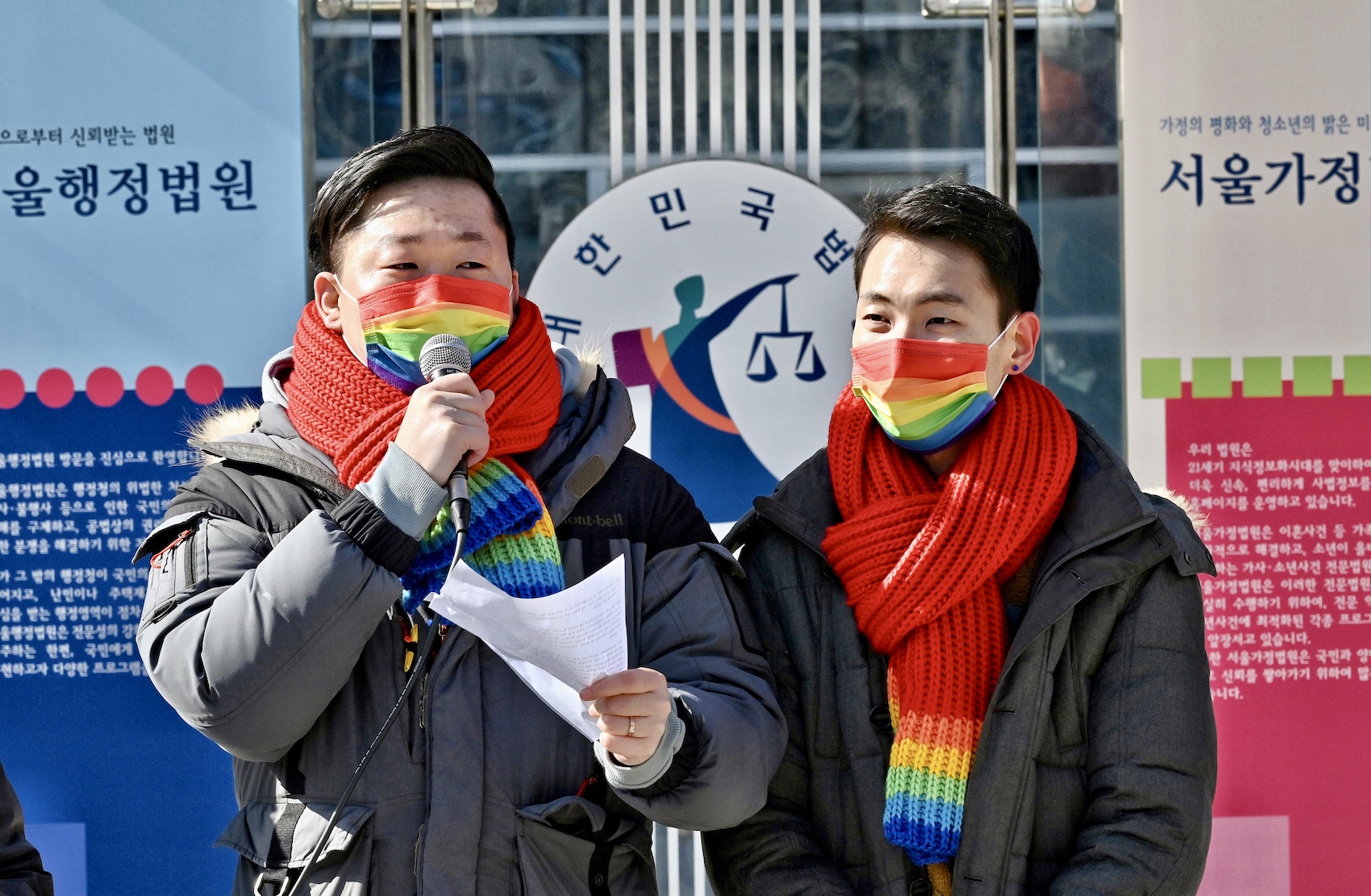 South Korean same-sex couple So Seong-wook (L) and Kim Yong-min (R) attend a press conference