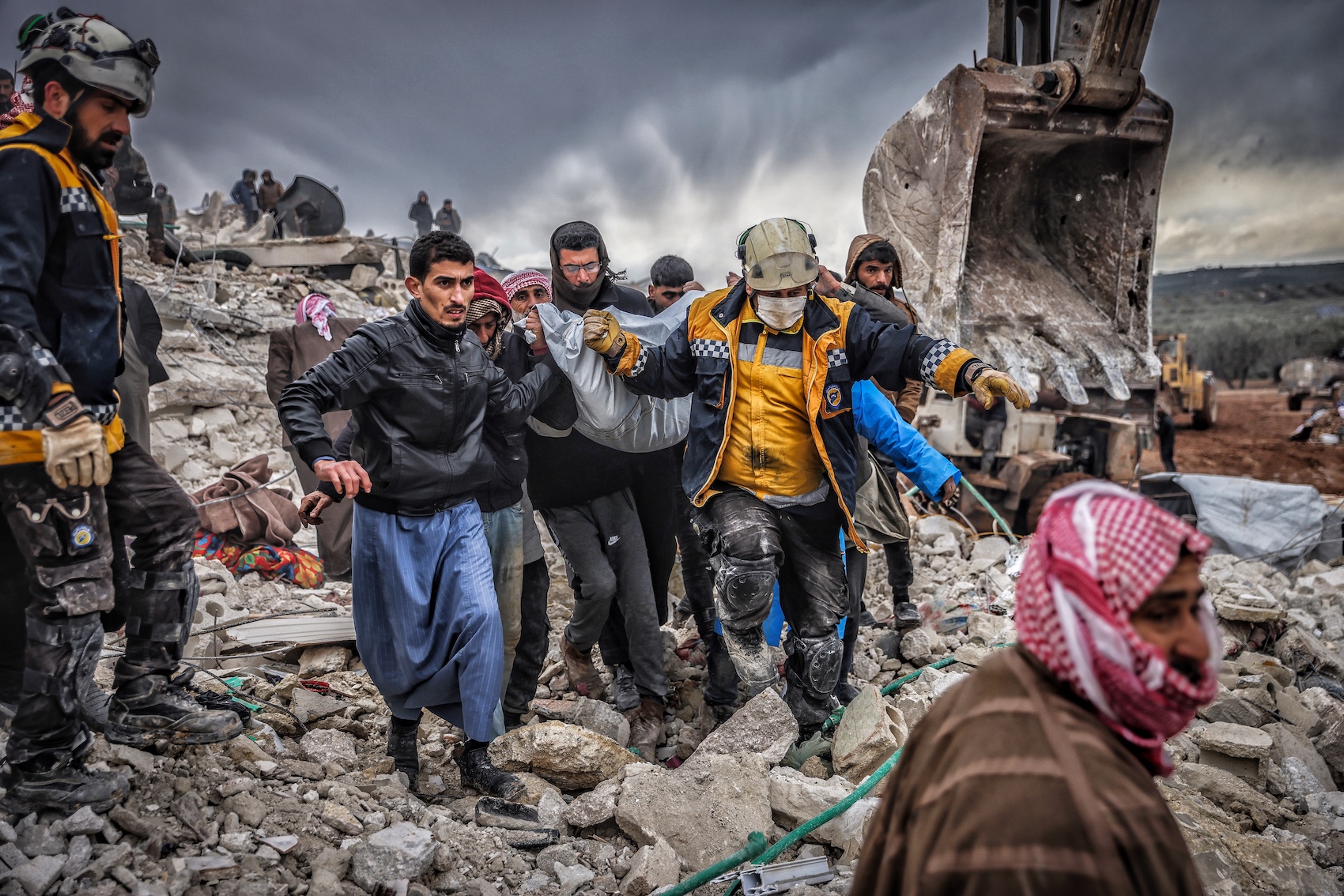 rescuers carrying people out from the collapsed buildings