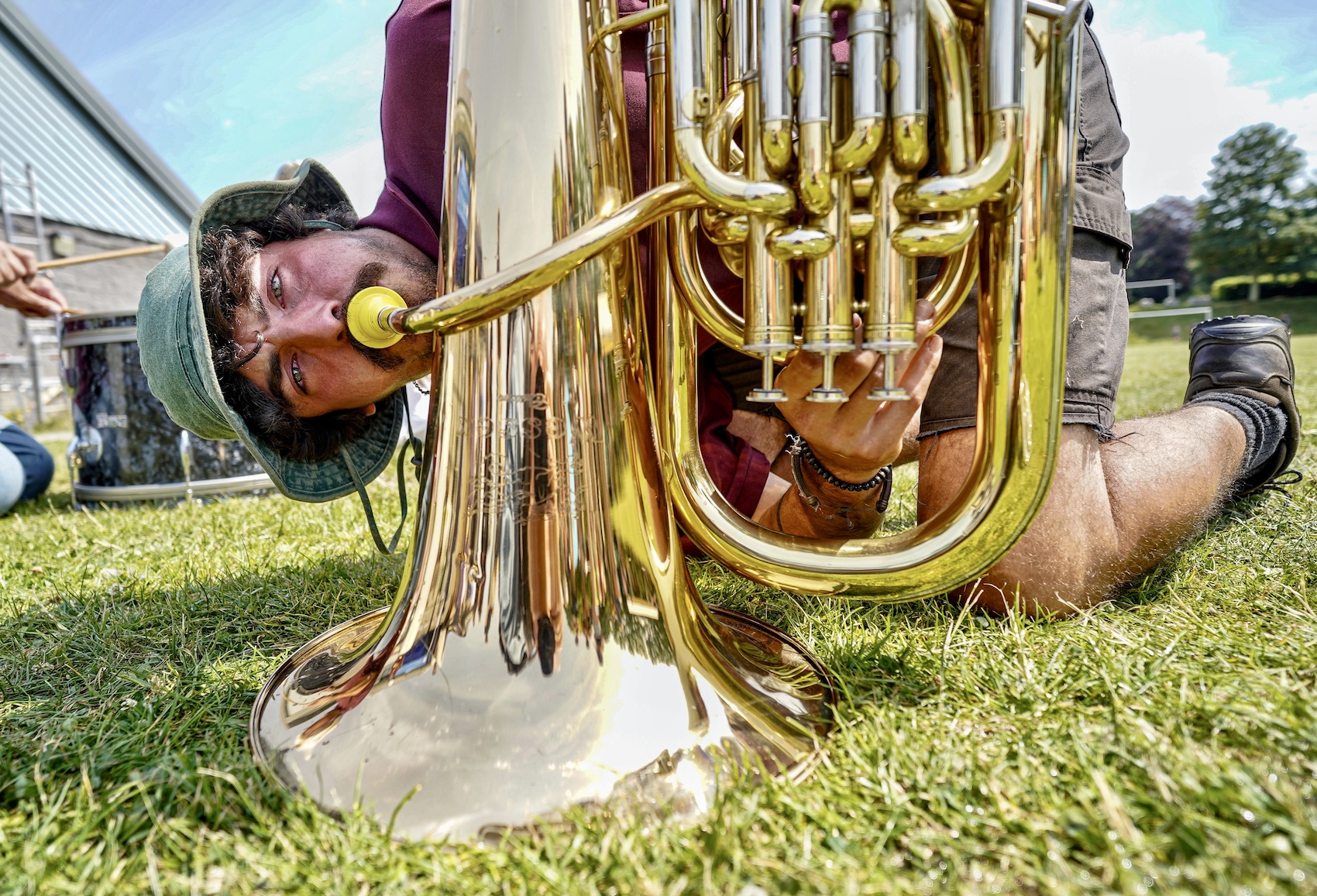 A competitor uses a brass instrument trumpet to lure worms