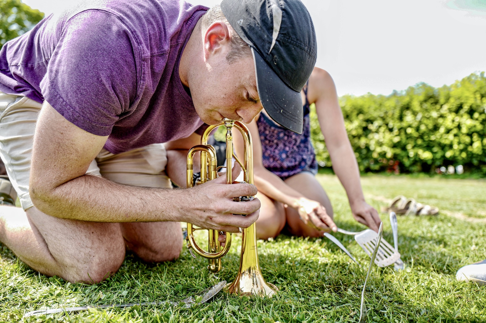 A competitor uses a trumpet to lure worms