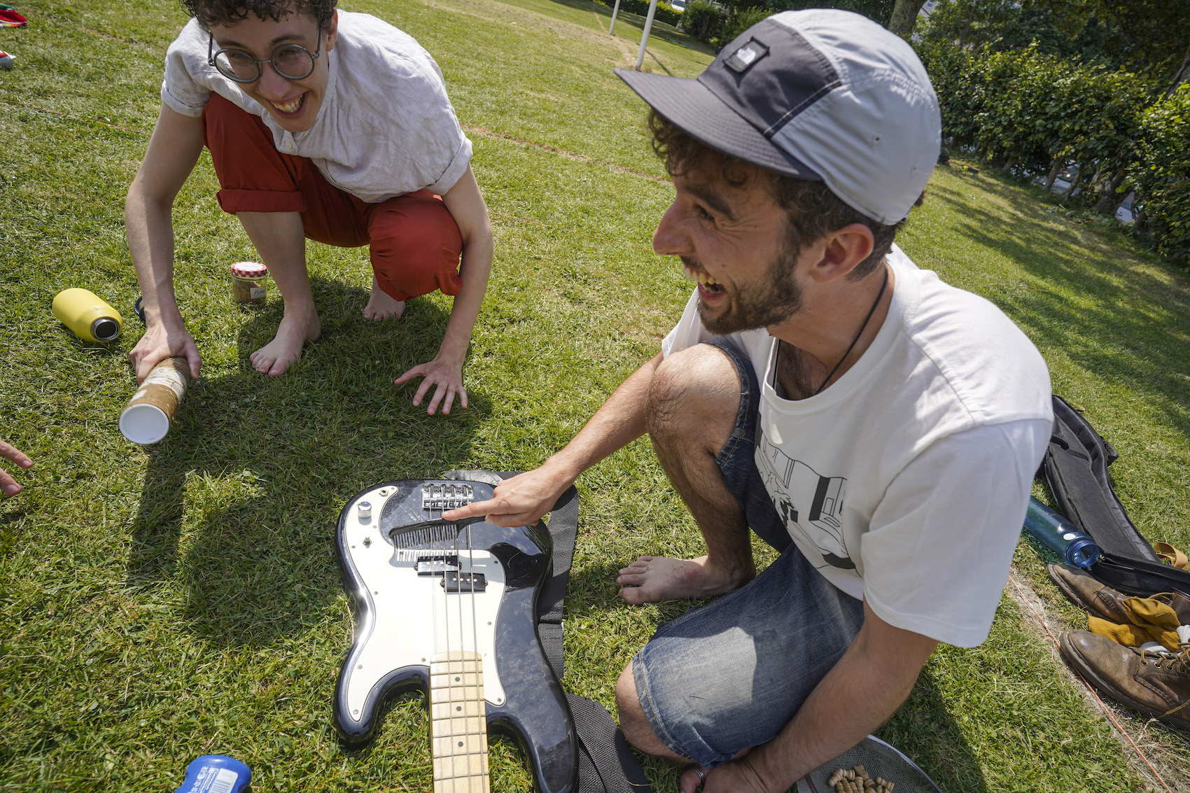 A group of competitors using guitar to play music and attract the worms out