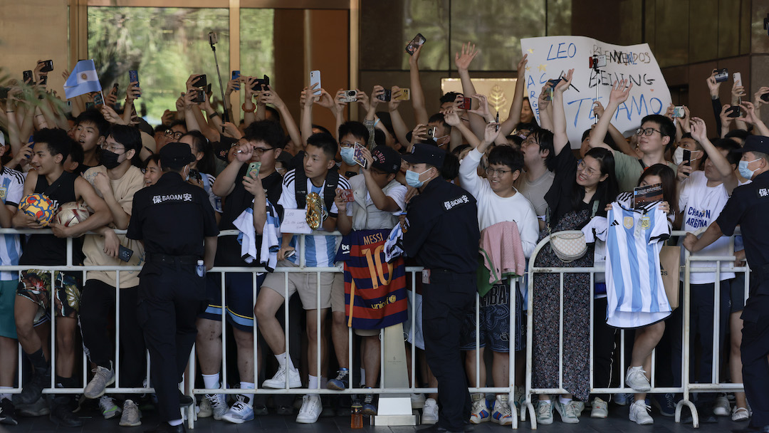 chinese fans wait for Argentine football player Lionel Messi outside hotel in Beijing, China.