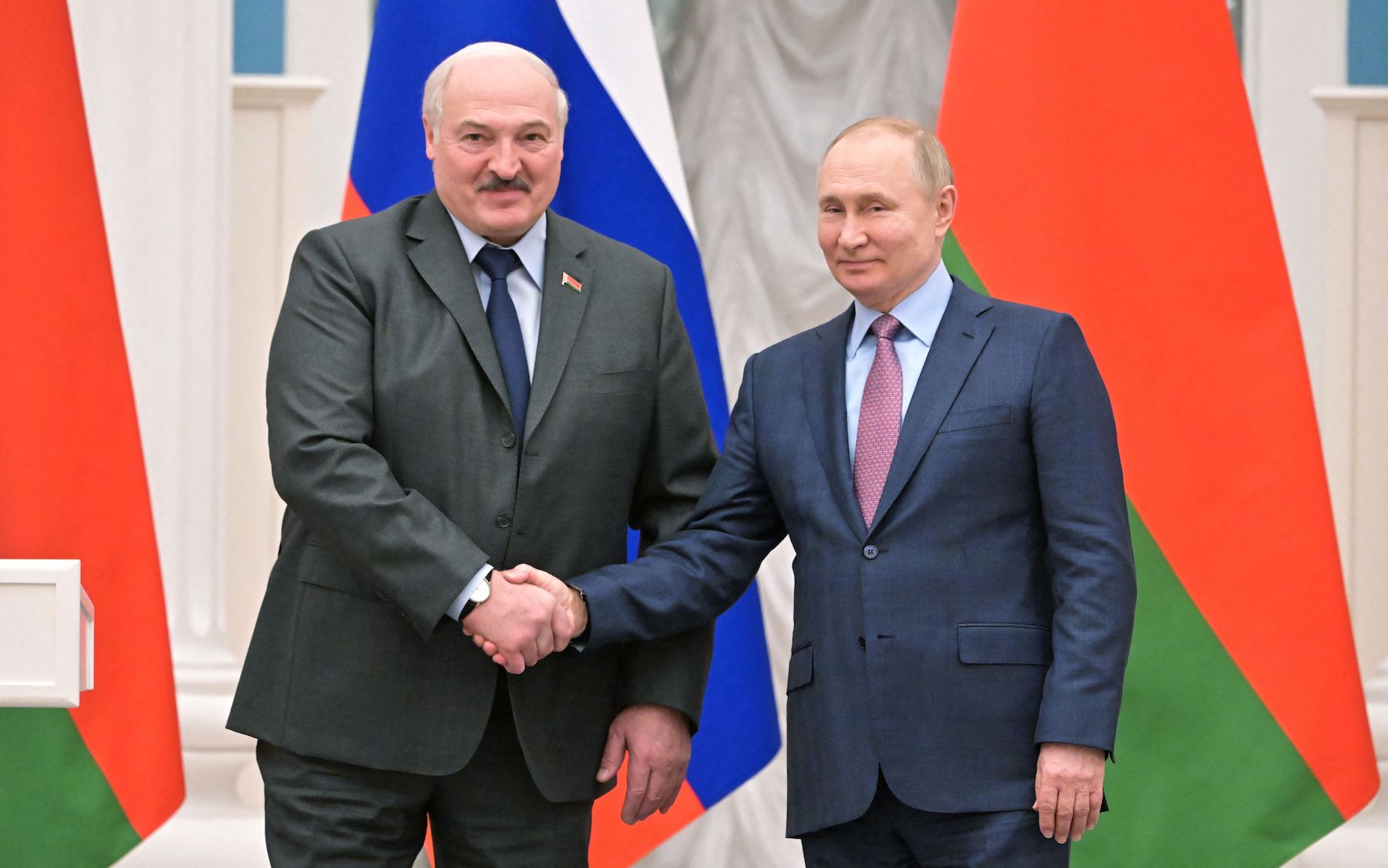 Russia's president Putin shakes hands with Belarus' president Aleksander Lukashenko