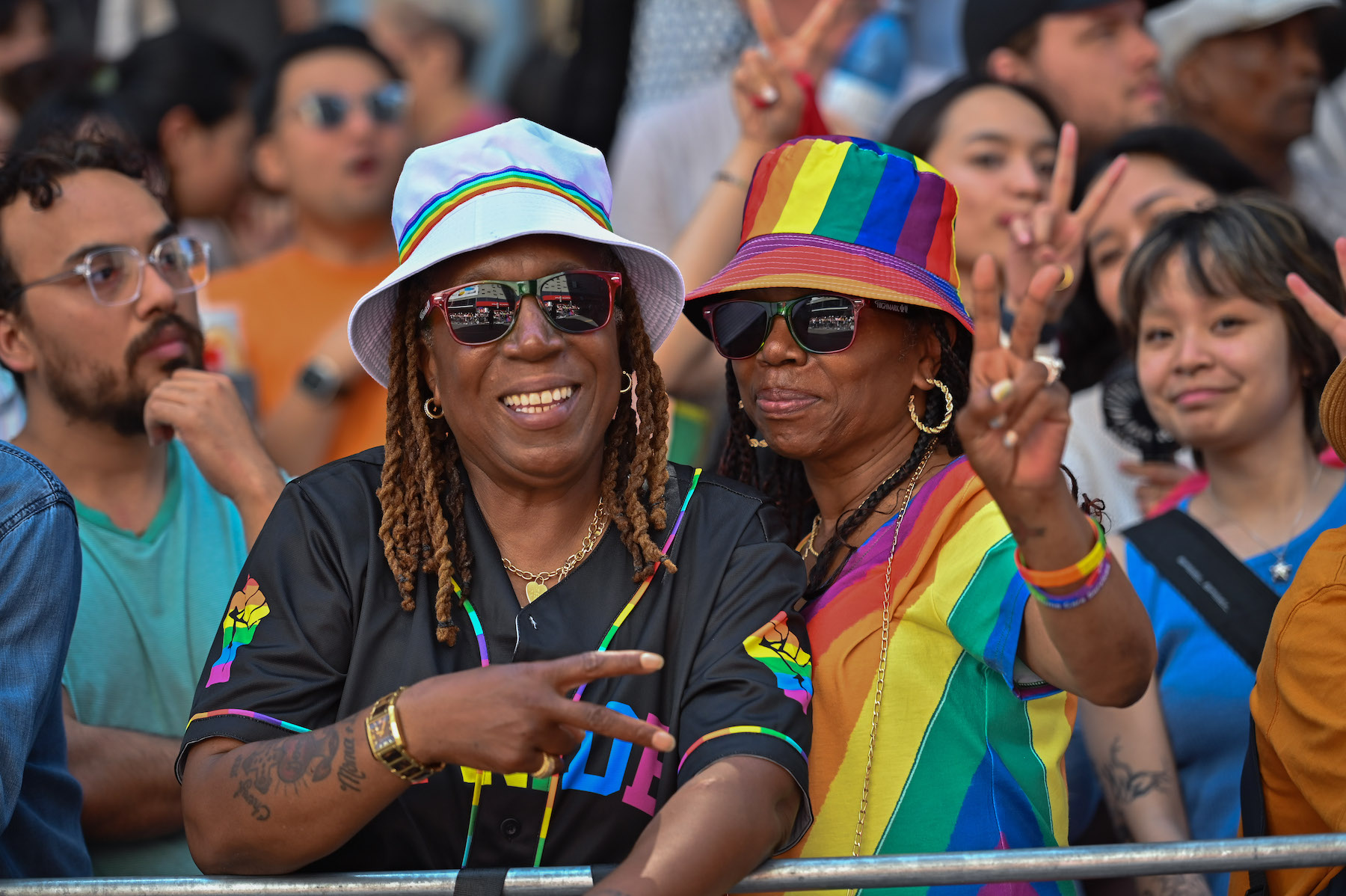 Two women pose for a picture at Toronto's pride march