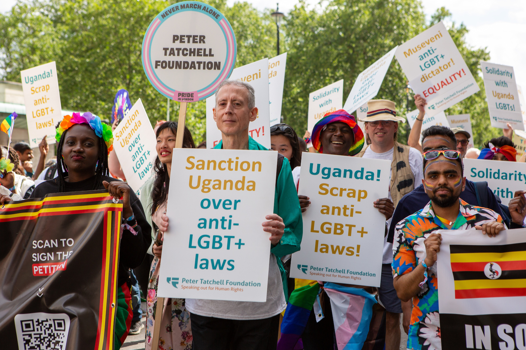 UK LGBTQ activists hold placards opposing Uganda's anti LGBTQ laws  