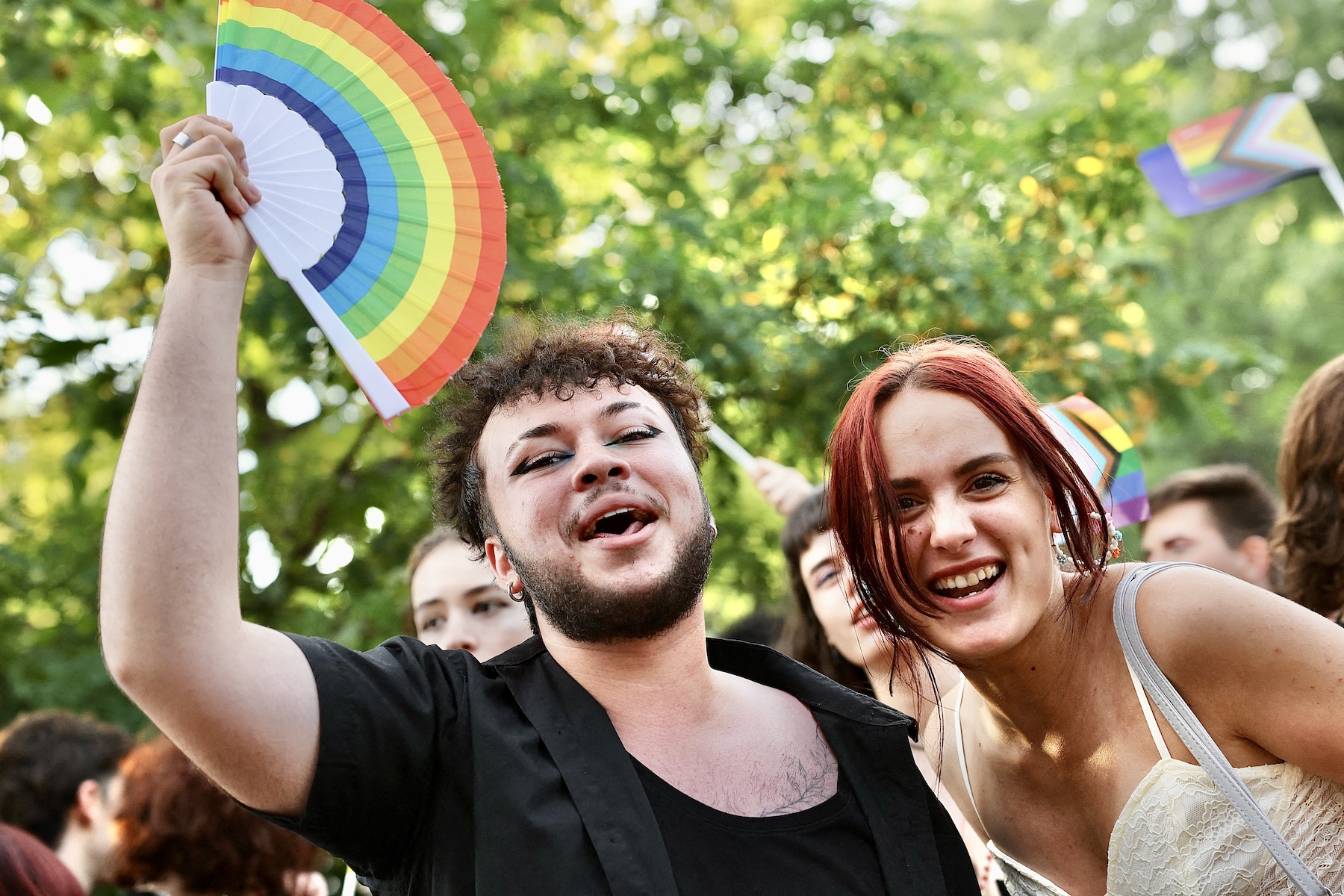 Two people pose for a picture at Romania's LGBTQ march