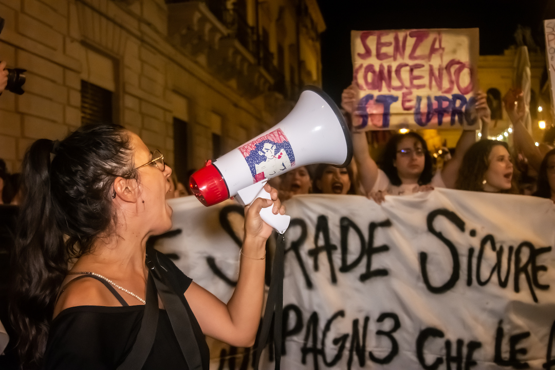italy gang rape palermo protest megaphone