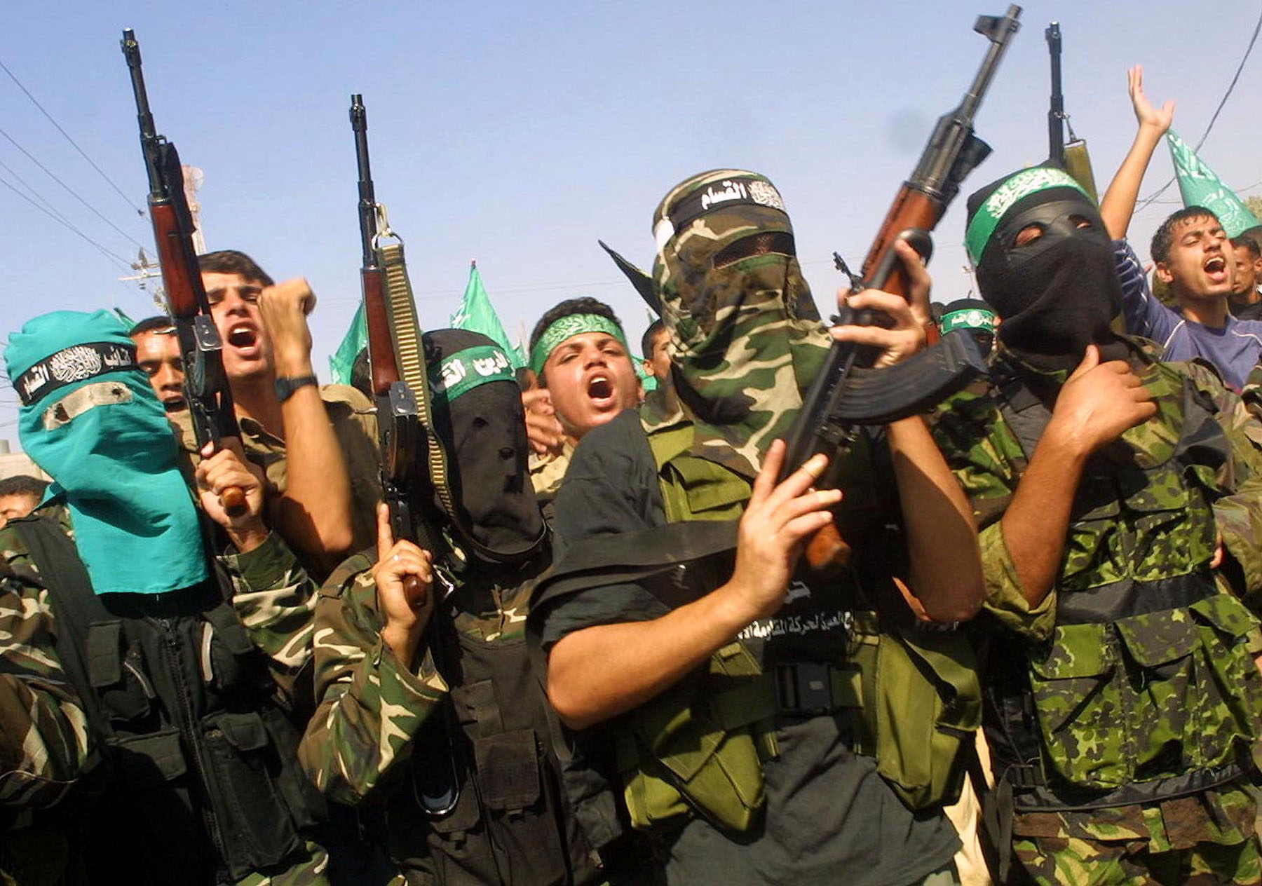 Masked Palestinian Hamas militants attend the funeral