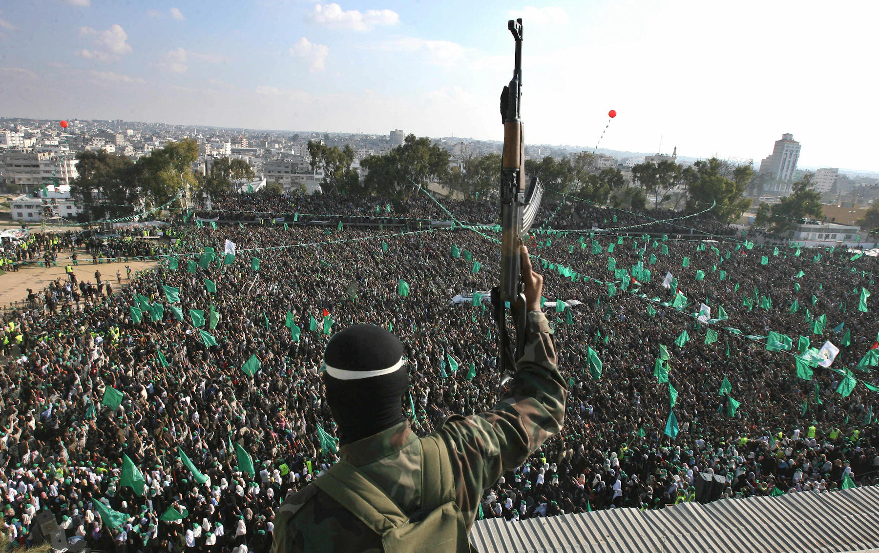supporters of the ruling Hamas party attend a rally in Gaza City