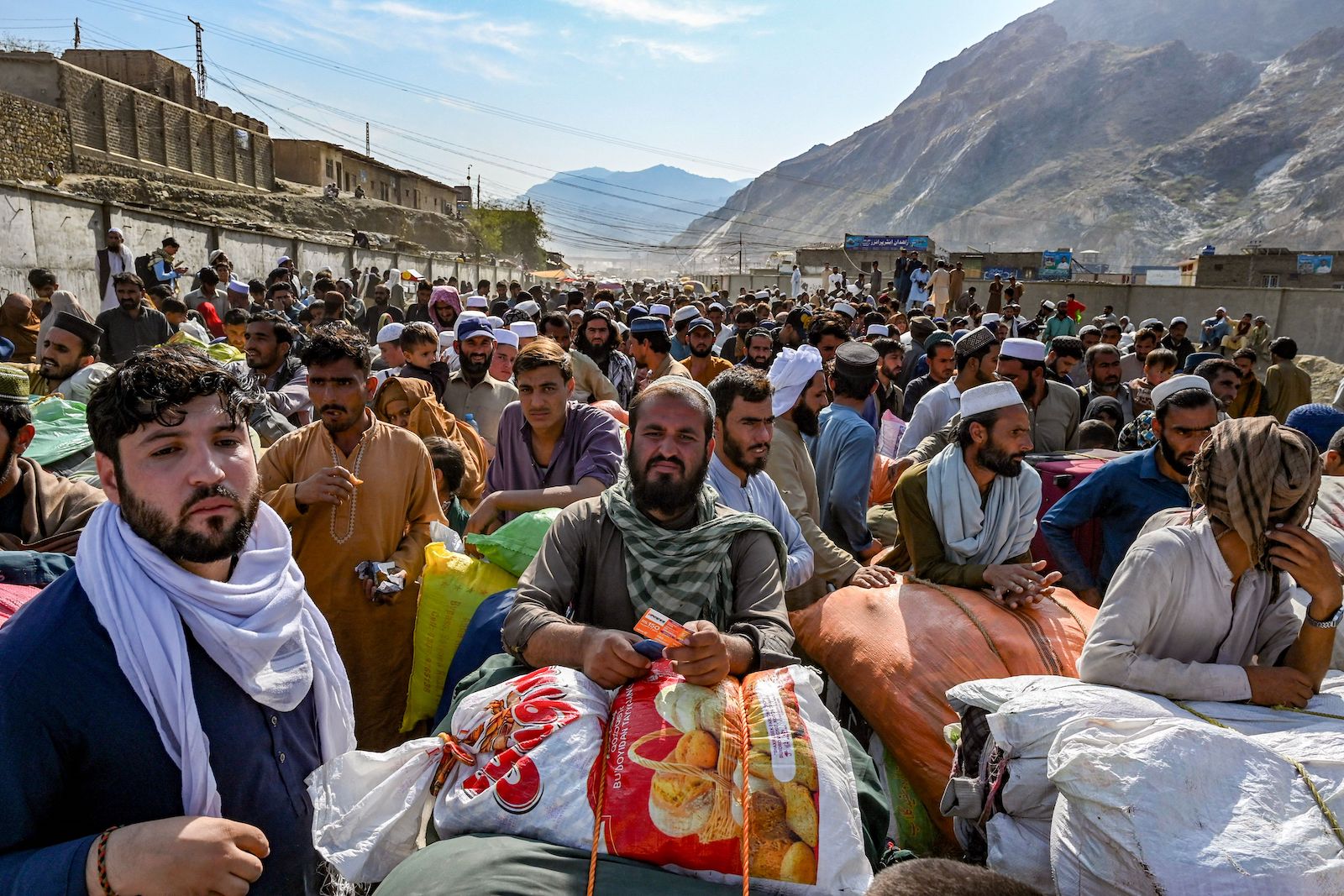 Afghan refugees wait in a queue to cross the Pakistan Afghanistan border 2023