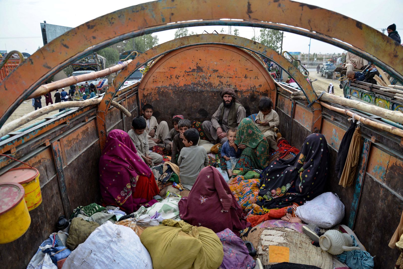 Afghan refugees with their belongings arrive on trucks from Pakistan expelled by taliban