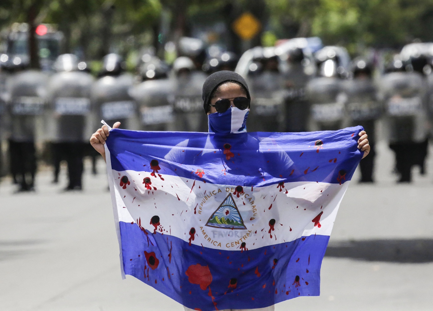bloody flag during a protest against Nicaraguan President Daniel Ortega government