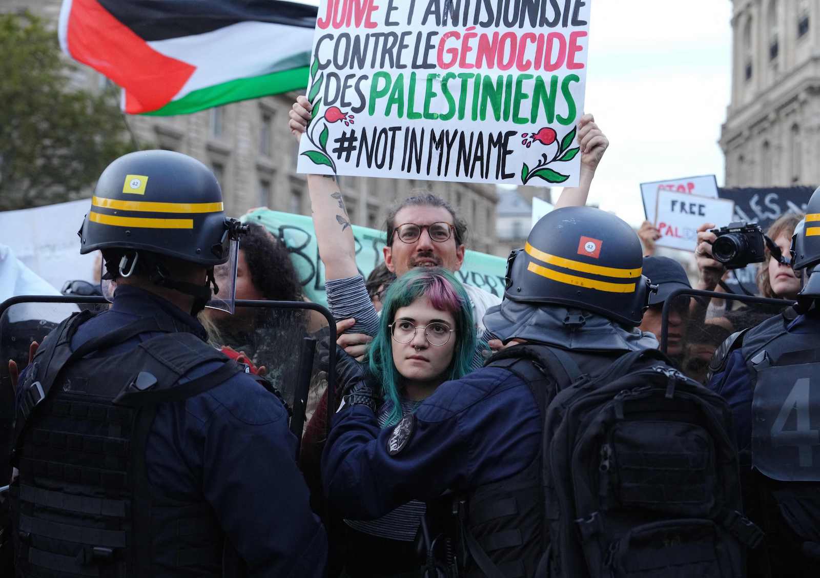 protester holding signs israel gaza palestine war