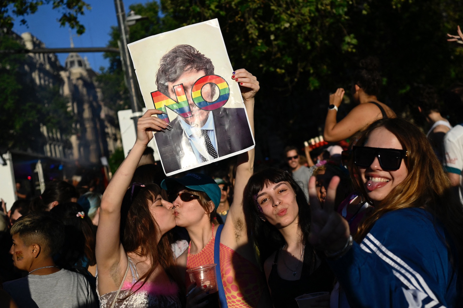 Revellers kiss while protesting against Argentine congressman and presidential candidate
