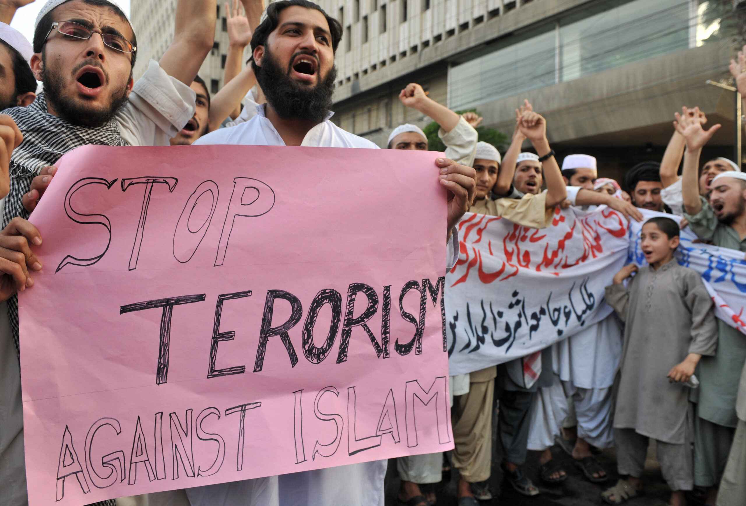 Pakistani Islamists shout anti Dutch lawmaker Geert Wilders protest scaled