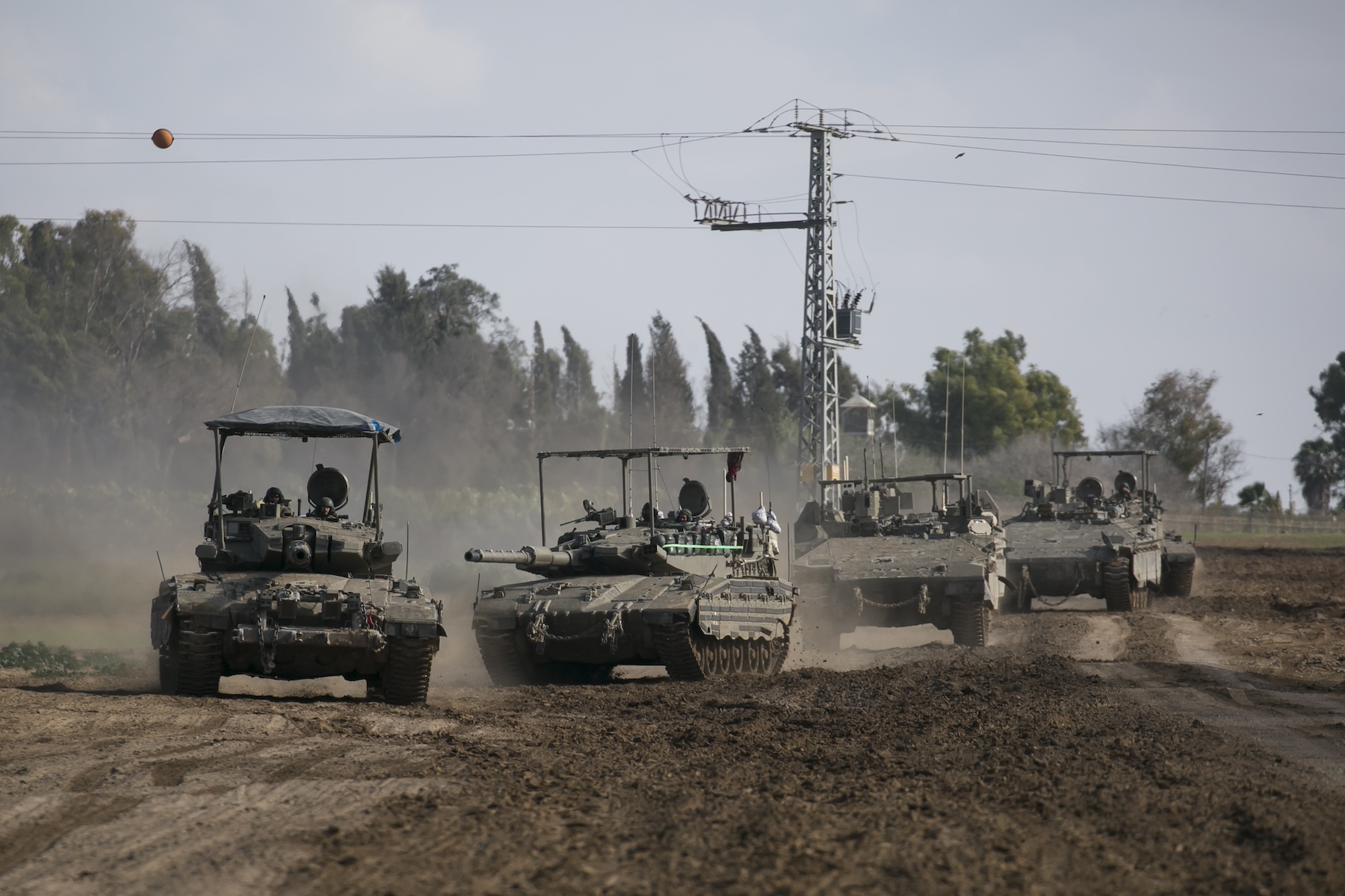 Israeli tanks armored personnel carriers move along border Gaza Strip