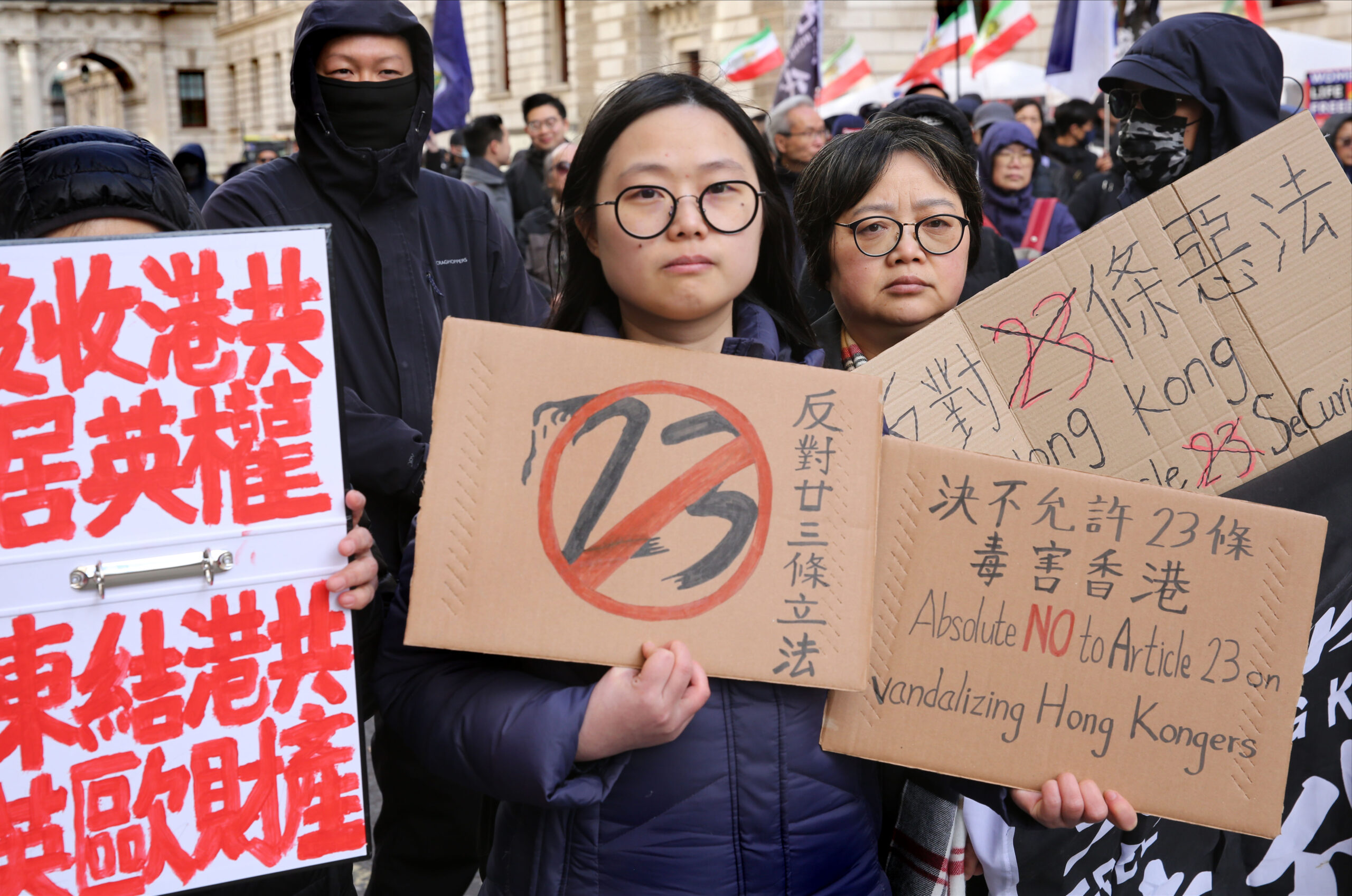 hong kong passed article 23 protesters signs against scaled